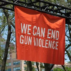 A banner that says we can end gun violence
