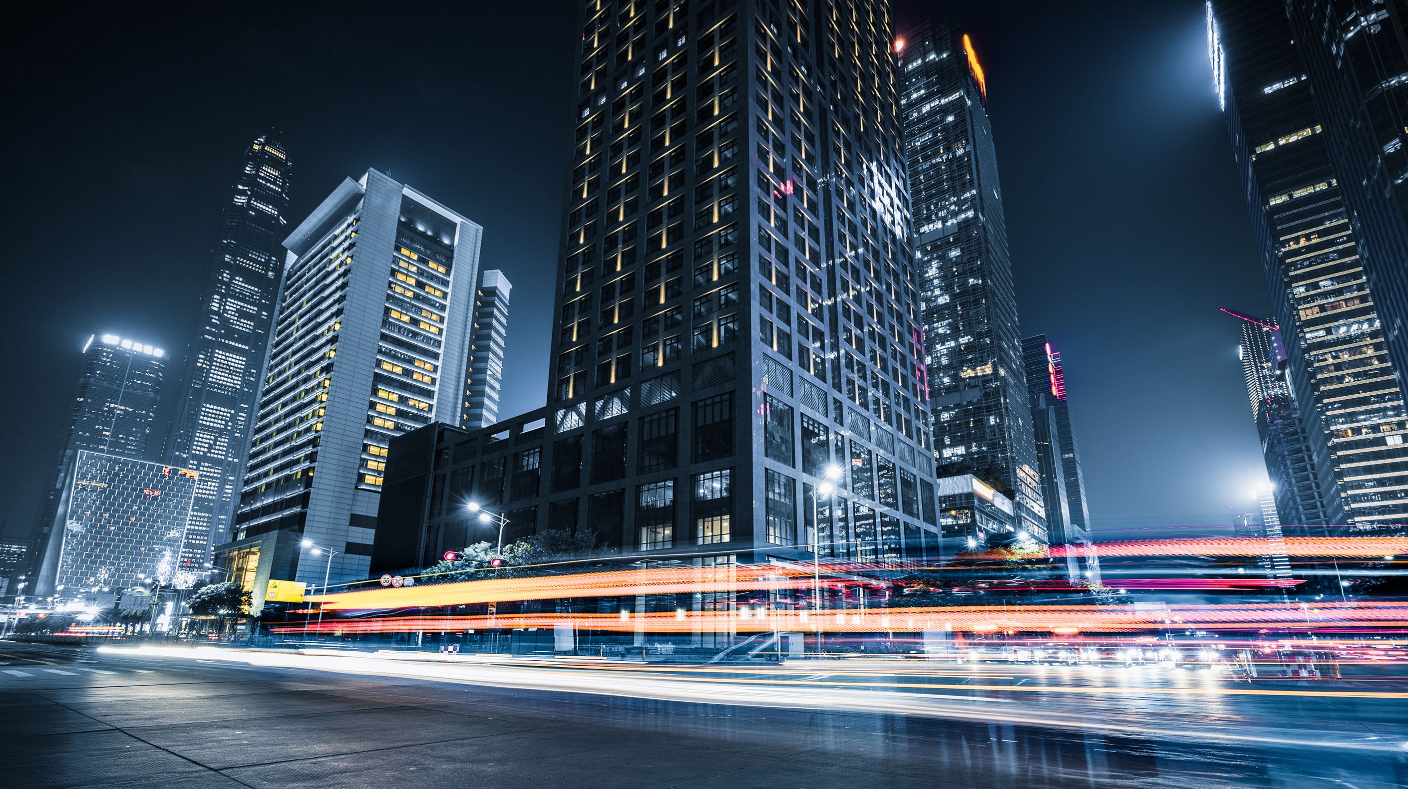 City landscape with vehicles rushing by