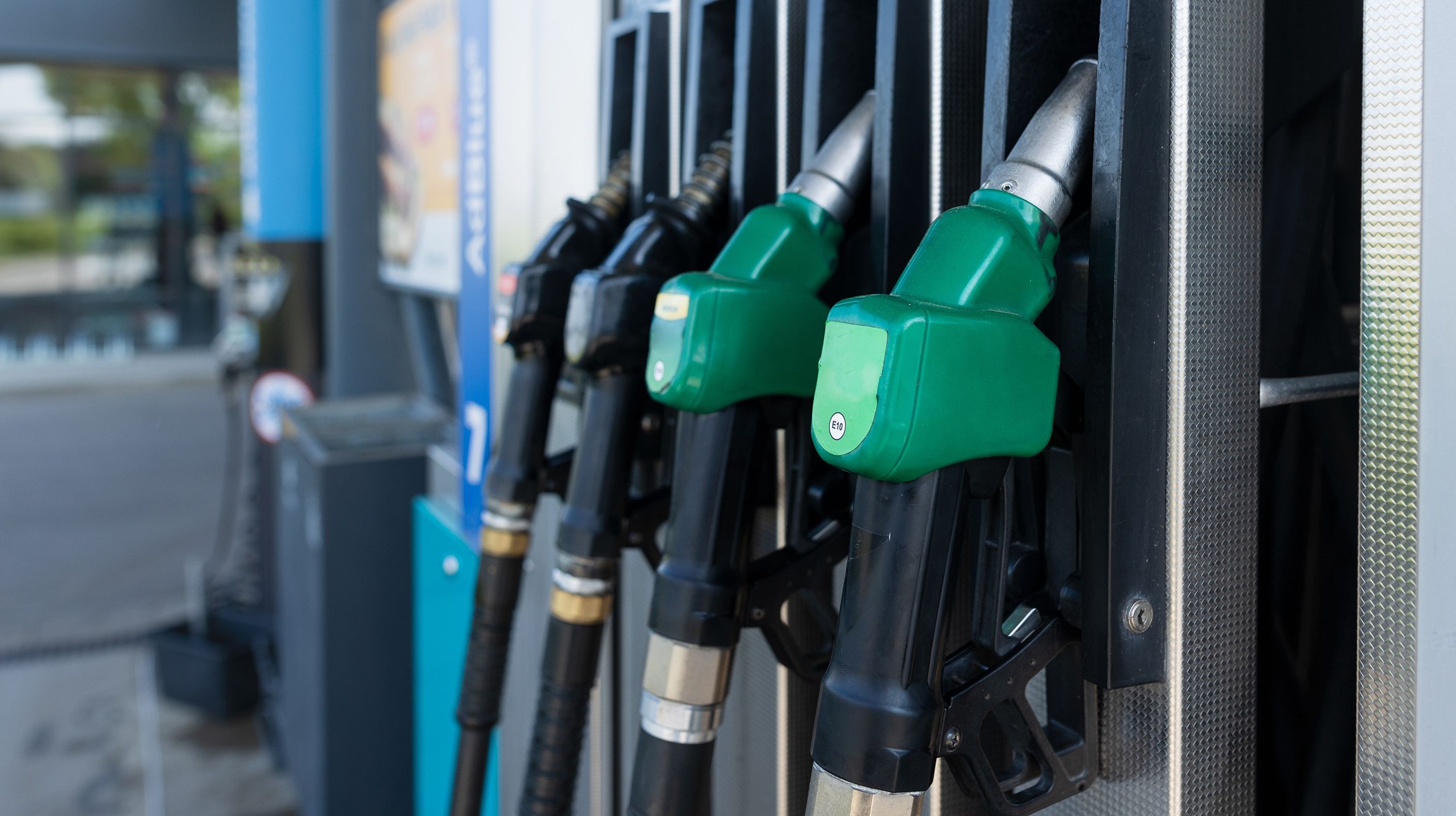 A photograph of a gas pump that has four different kinds of fuel.