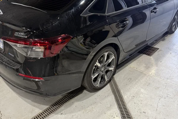 High-gloss professional car detailing and window tint on a black Honda Civic at Beyond Detail in Scarborough.