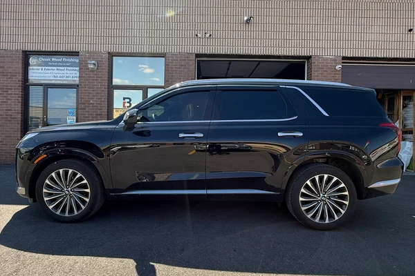 Luxury sedan with professionally installed window tint outside Beyond Detail Scarborough, showcasing high-quality ceramic film and heat rejection.