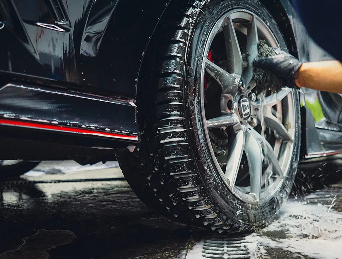 Professional car wheel cleaning and detailing service in Scarborough featuring a deep wash of rims and tires.