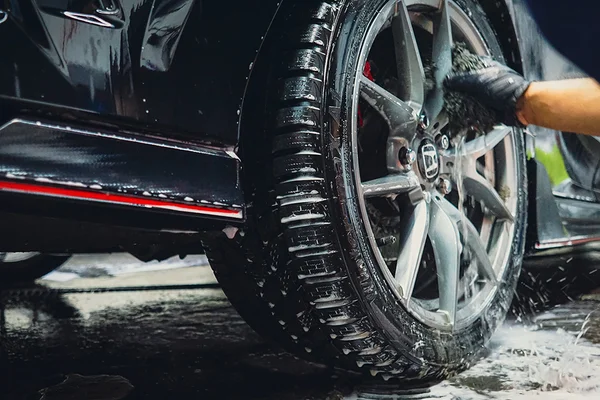Professional car wheel cleaning and detailing service in Scarborough featuring a deep wash of rims and tires.