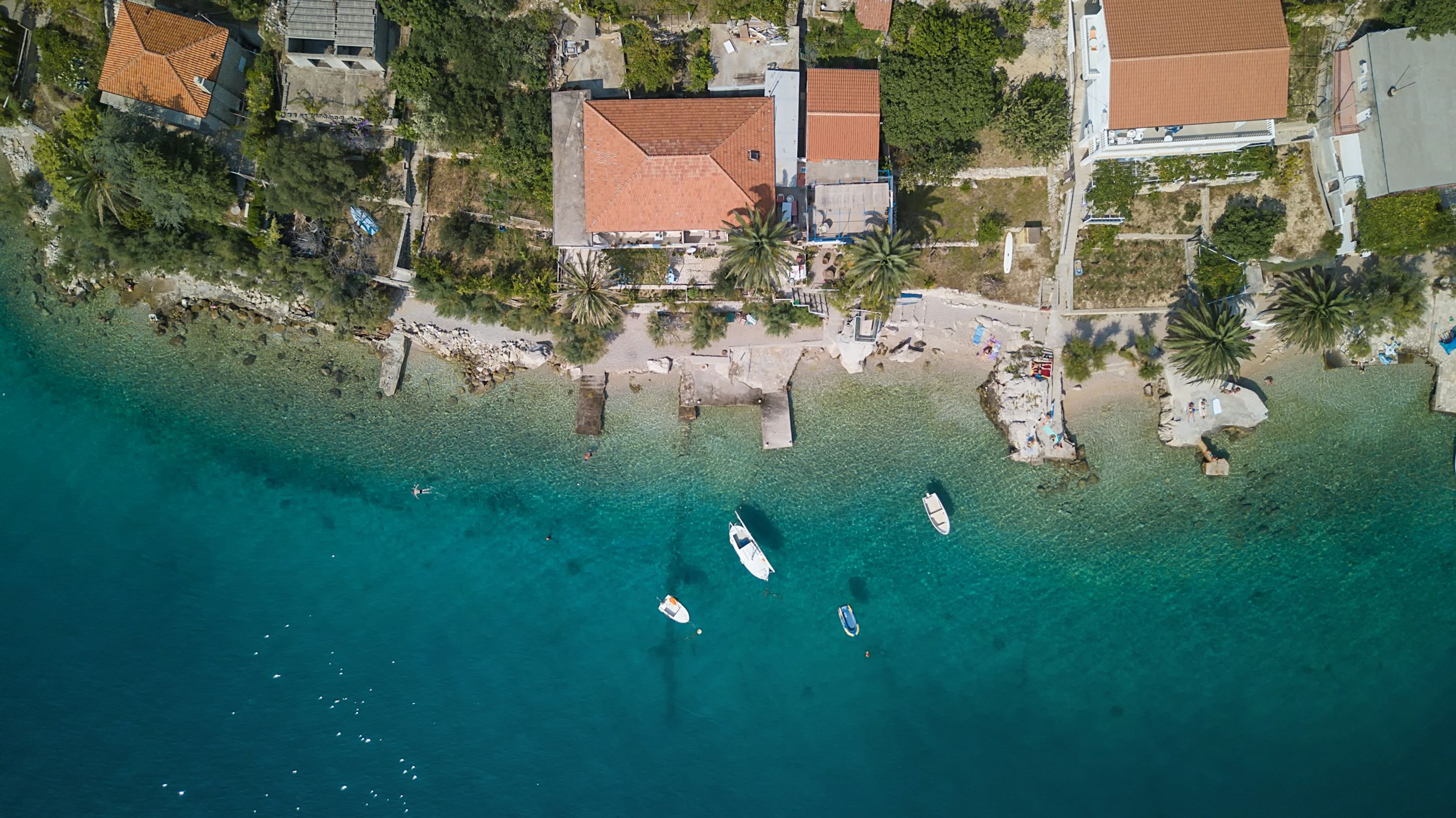 Boats moored beside stone houses