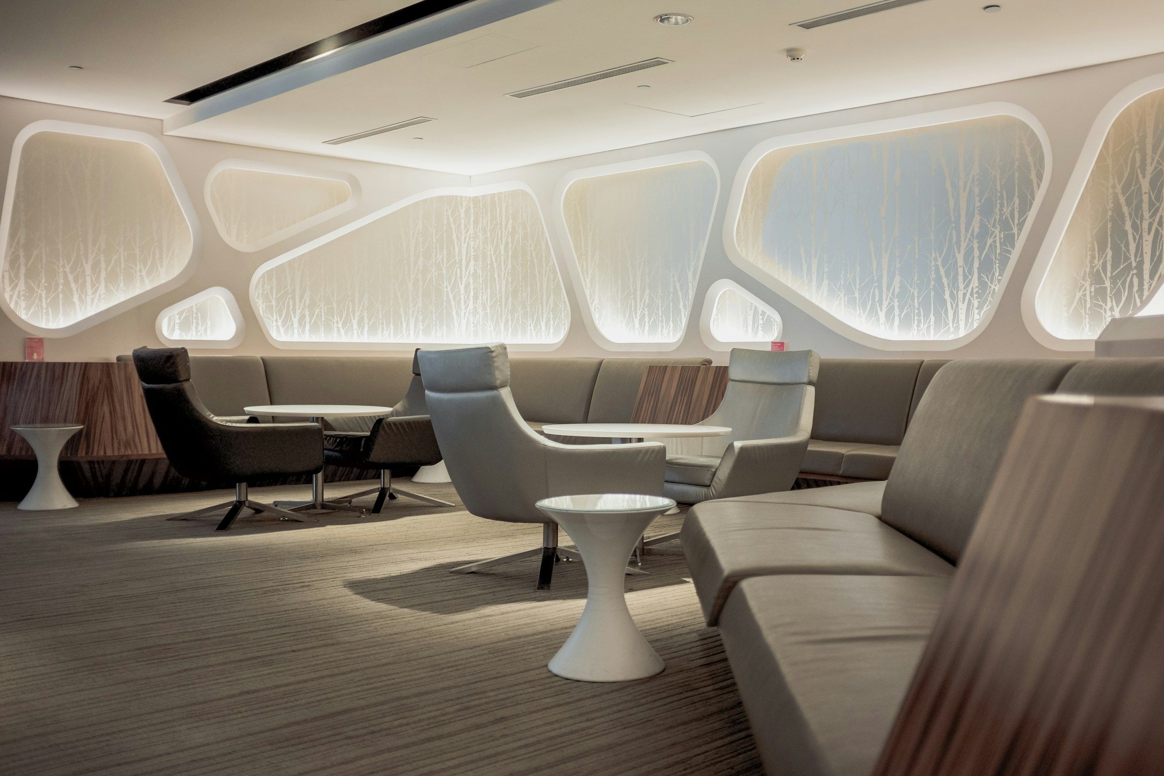 The main salon in white and warm wood