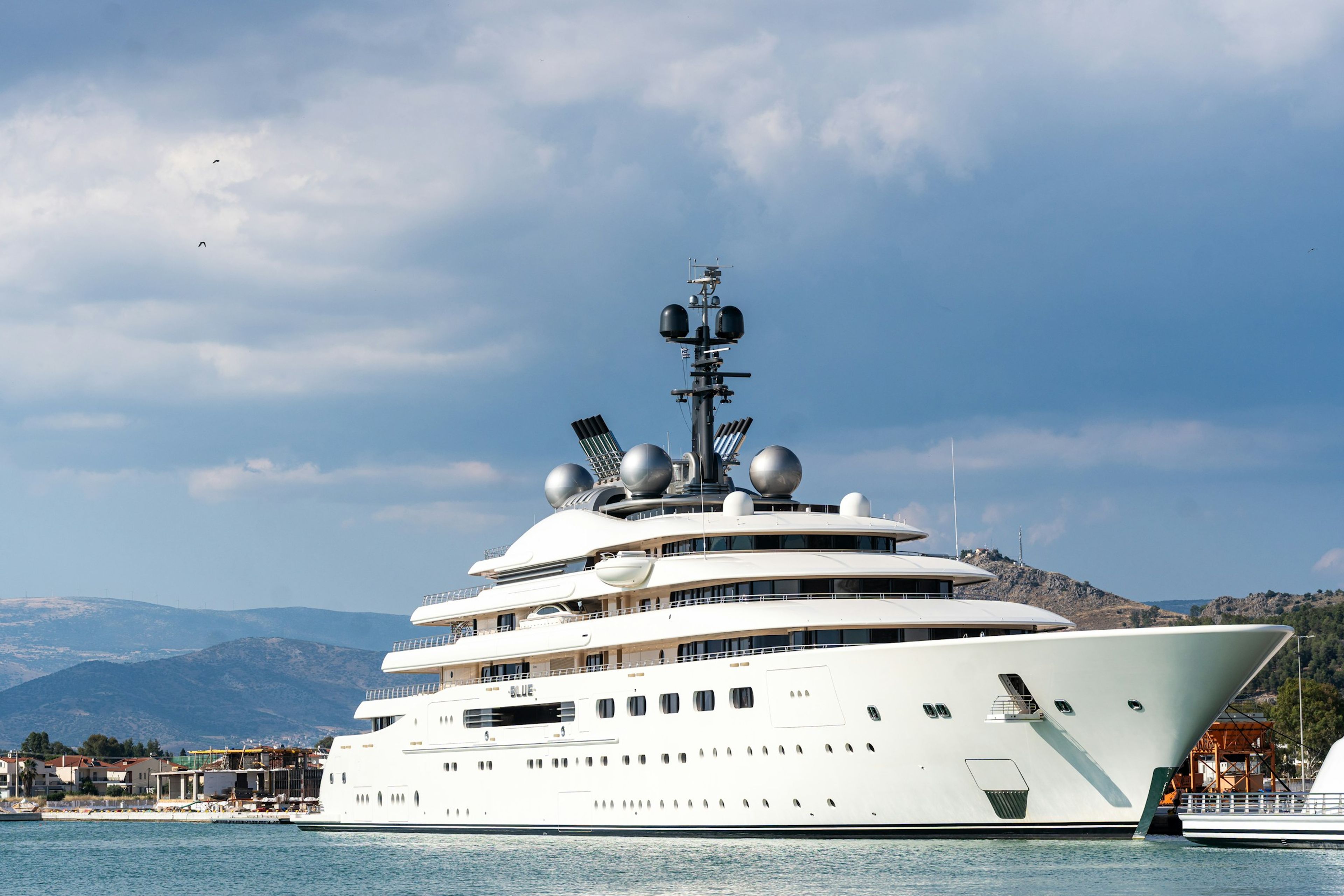 A superyacht moored in a bay