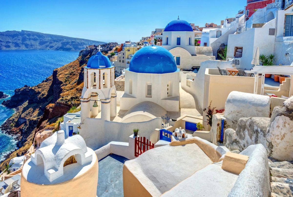 Blue-domed churches of Santorini above the Aegean
