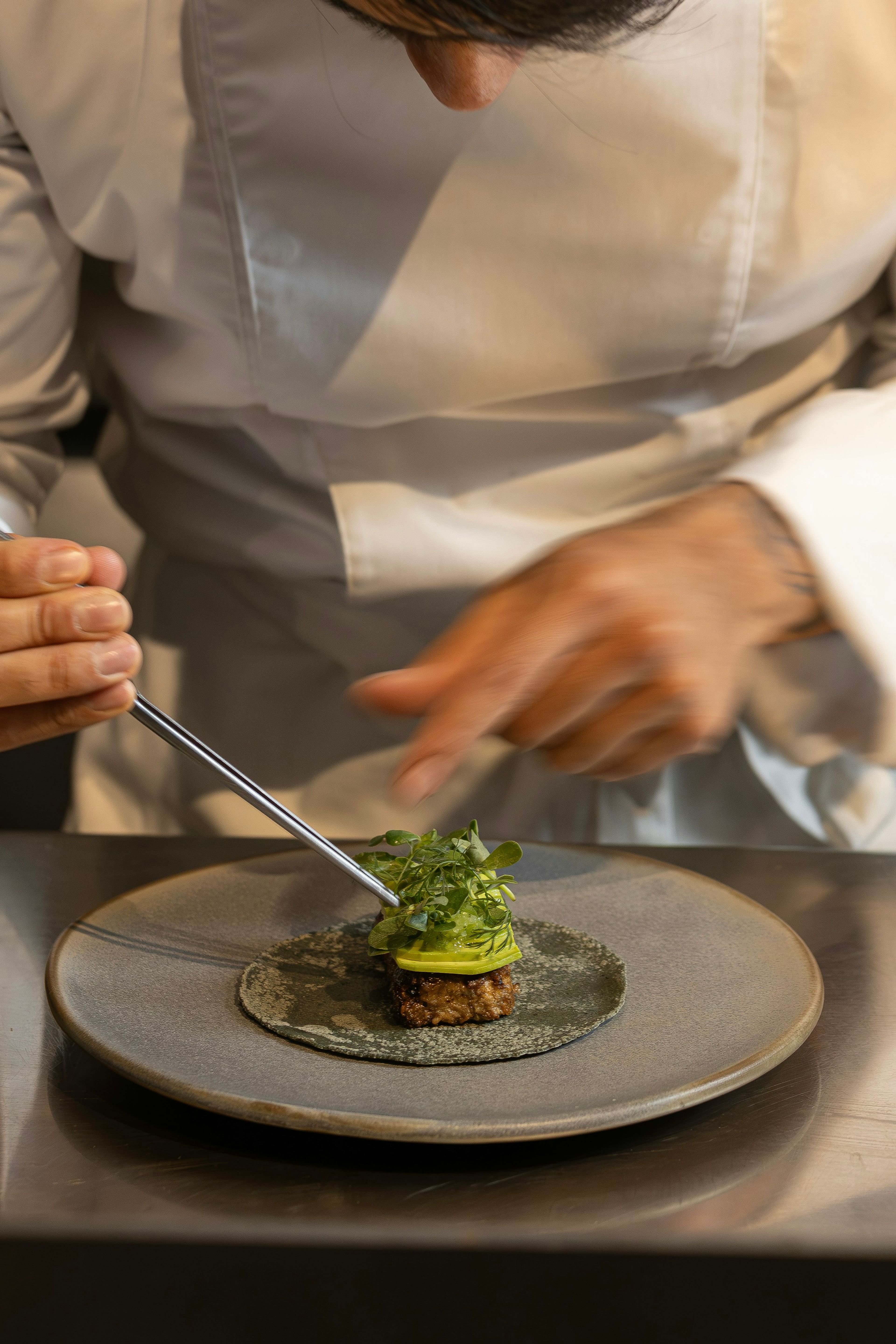 A chef plating a dish