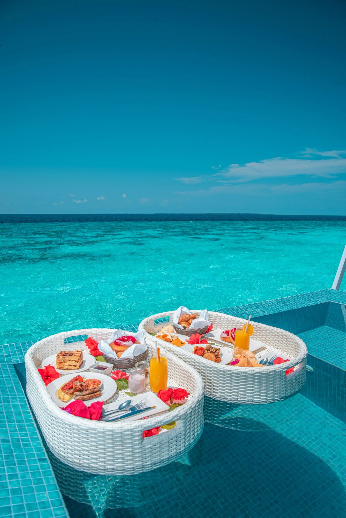 A floating breakfast tray on turquoise water