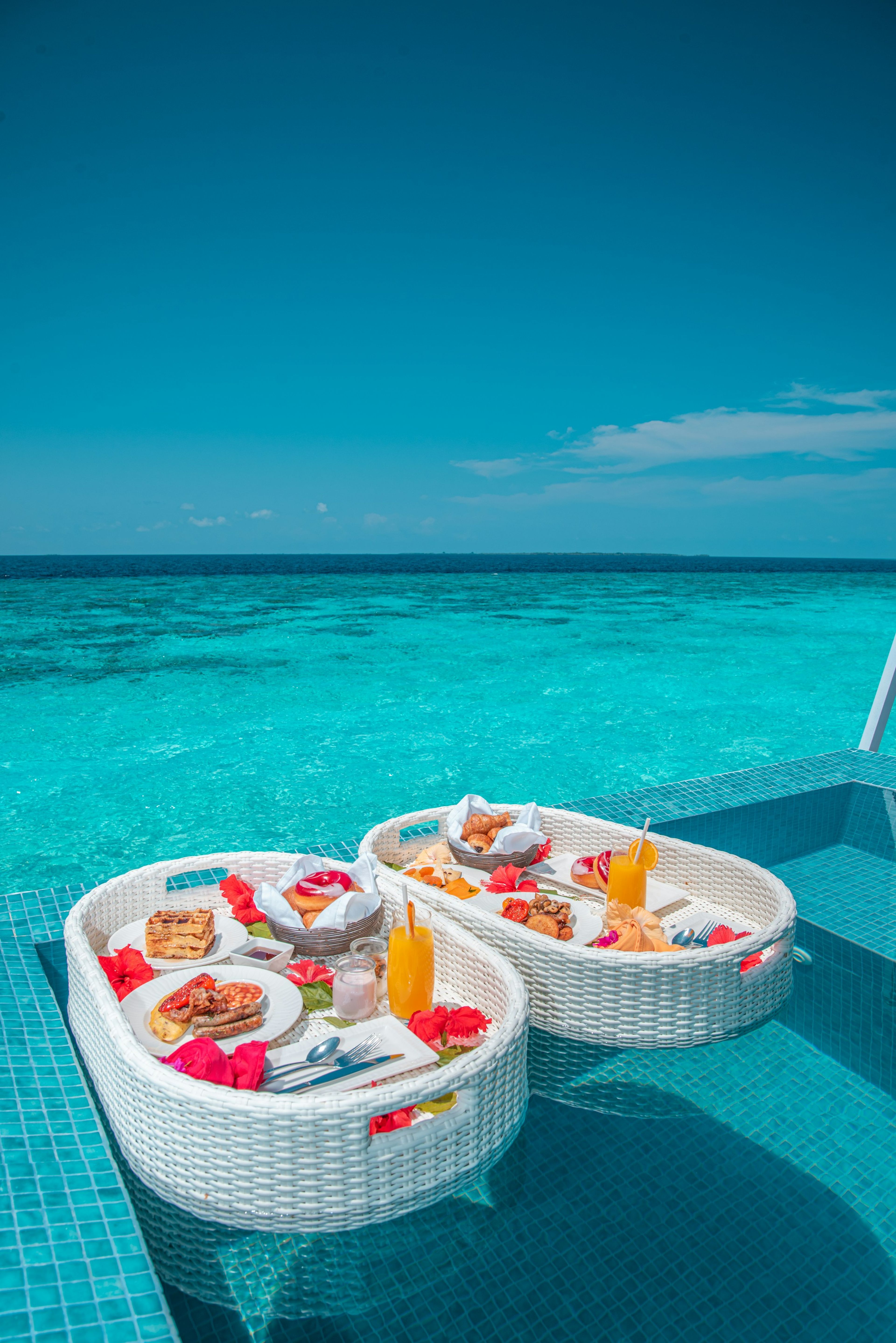 A floating breakfast tray on turquoise water