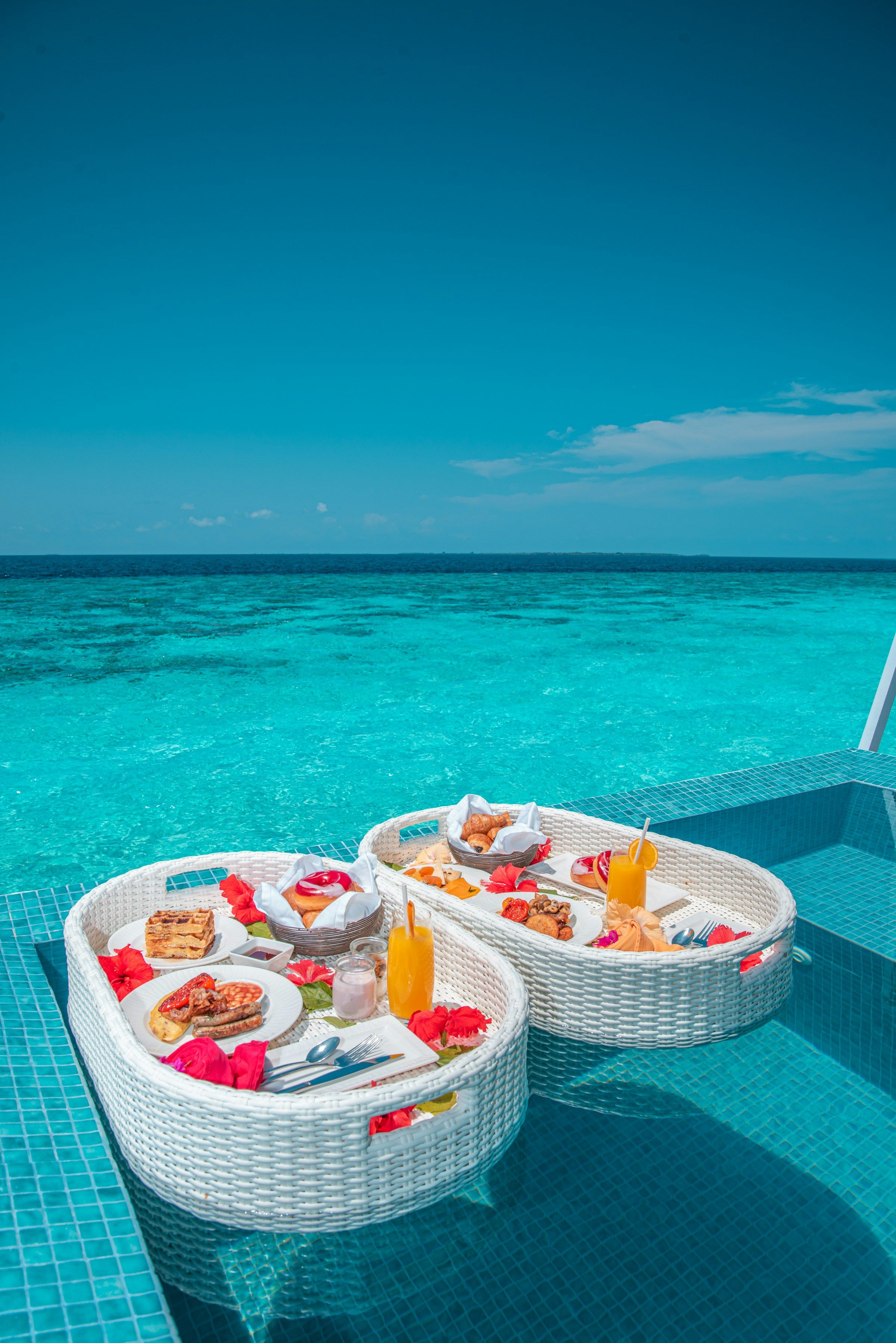 A floating breakfast tray on turquoise water
