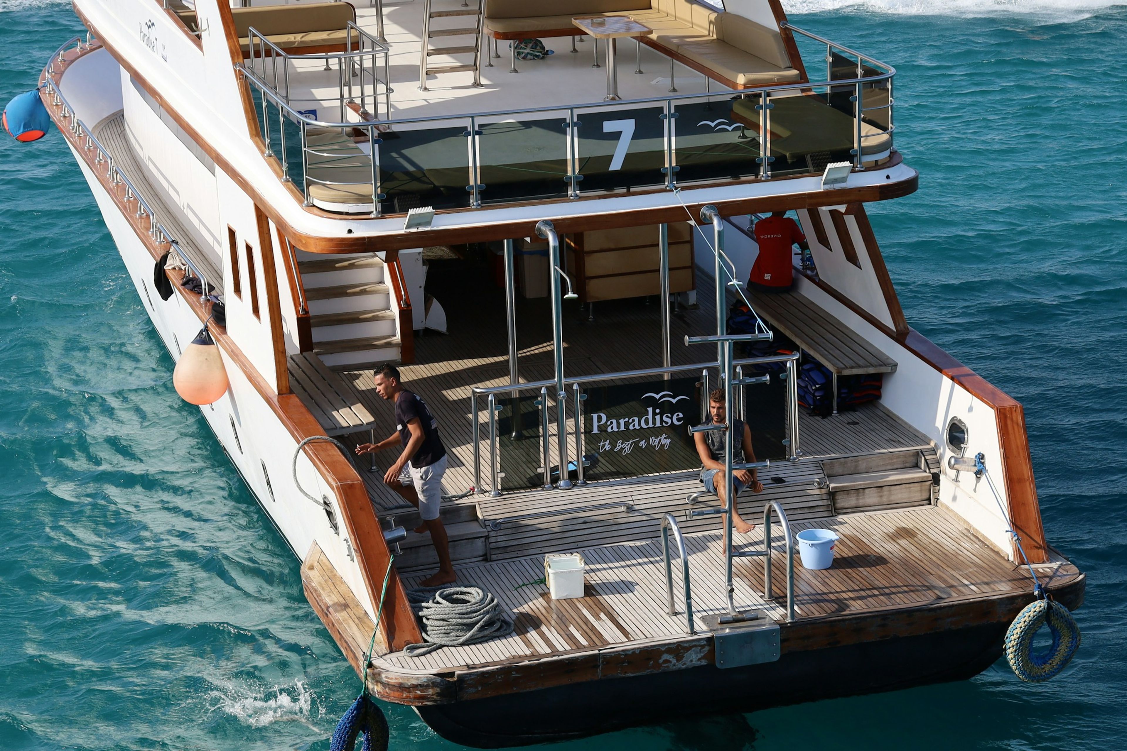 Crew and guests on the aft deck