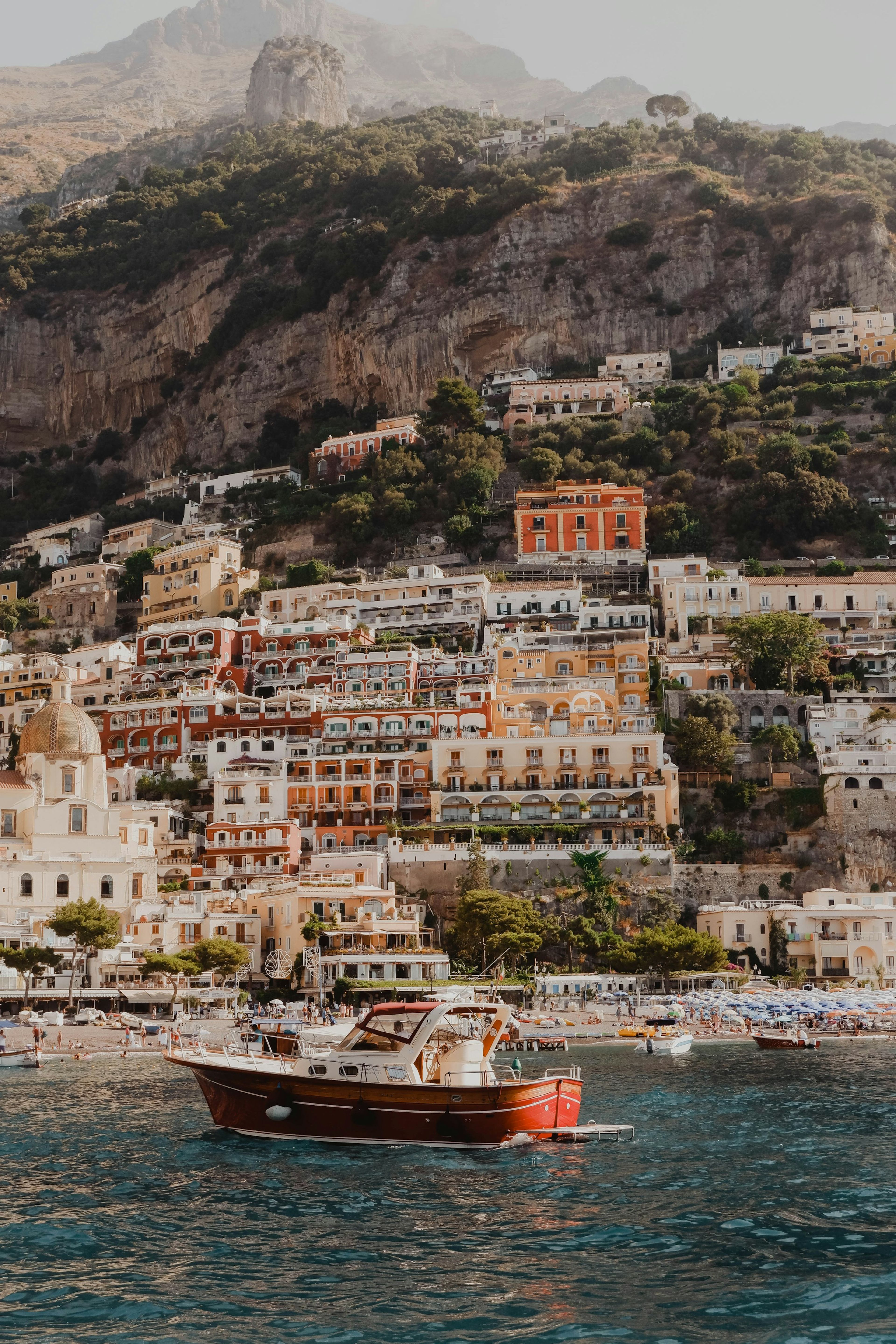 White and terracotta buildings by the water