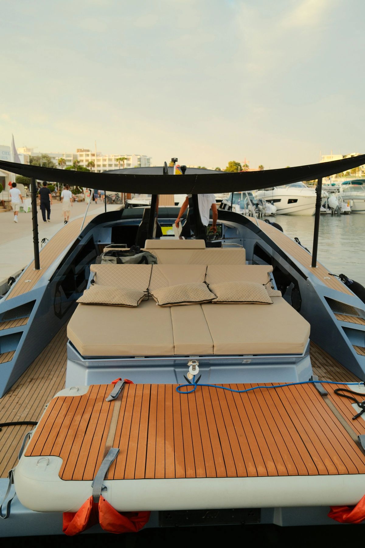 A teak sun deck with cushioned loungers
