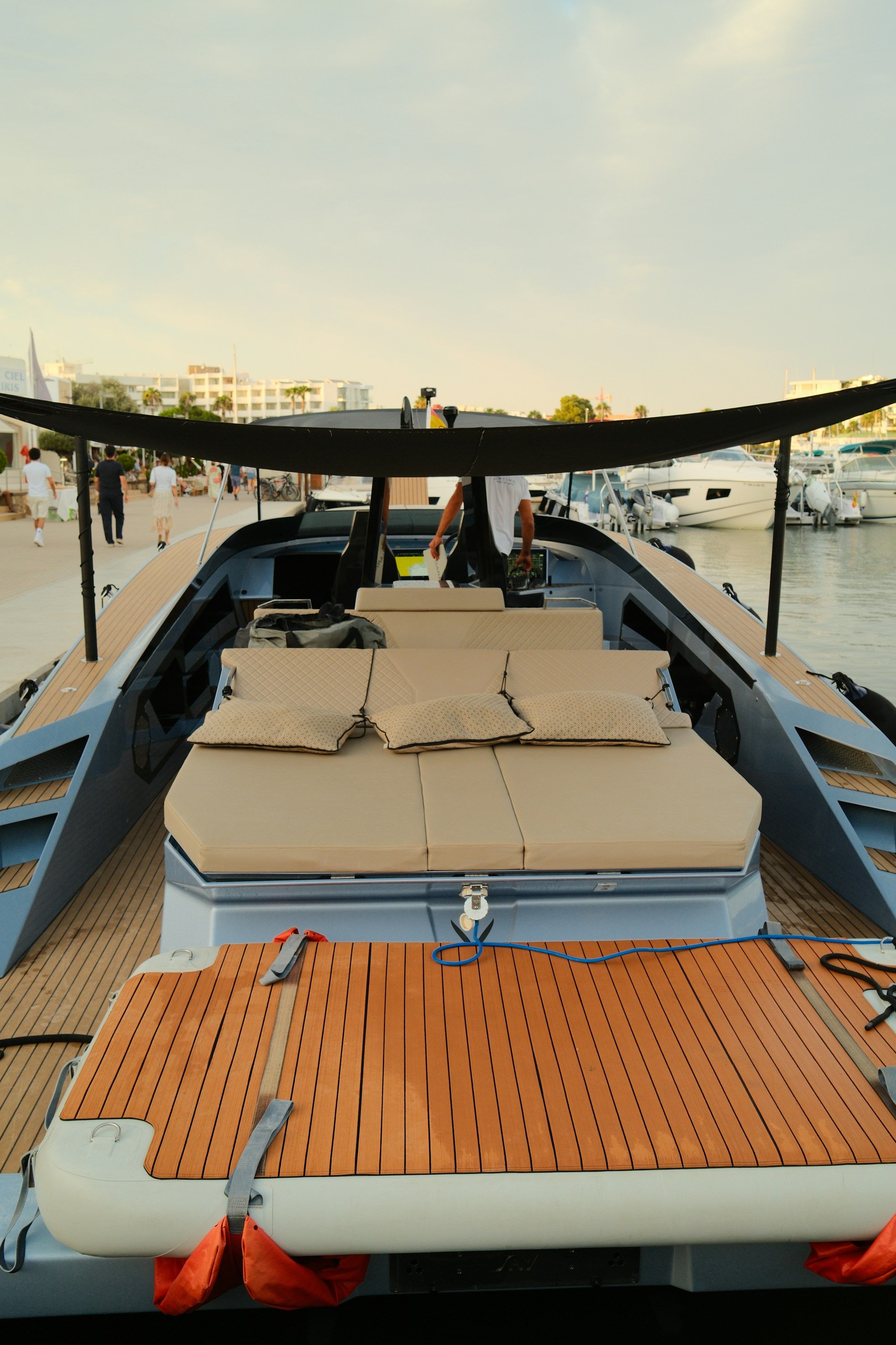 A teak sun deck with cushioned loungers