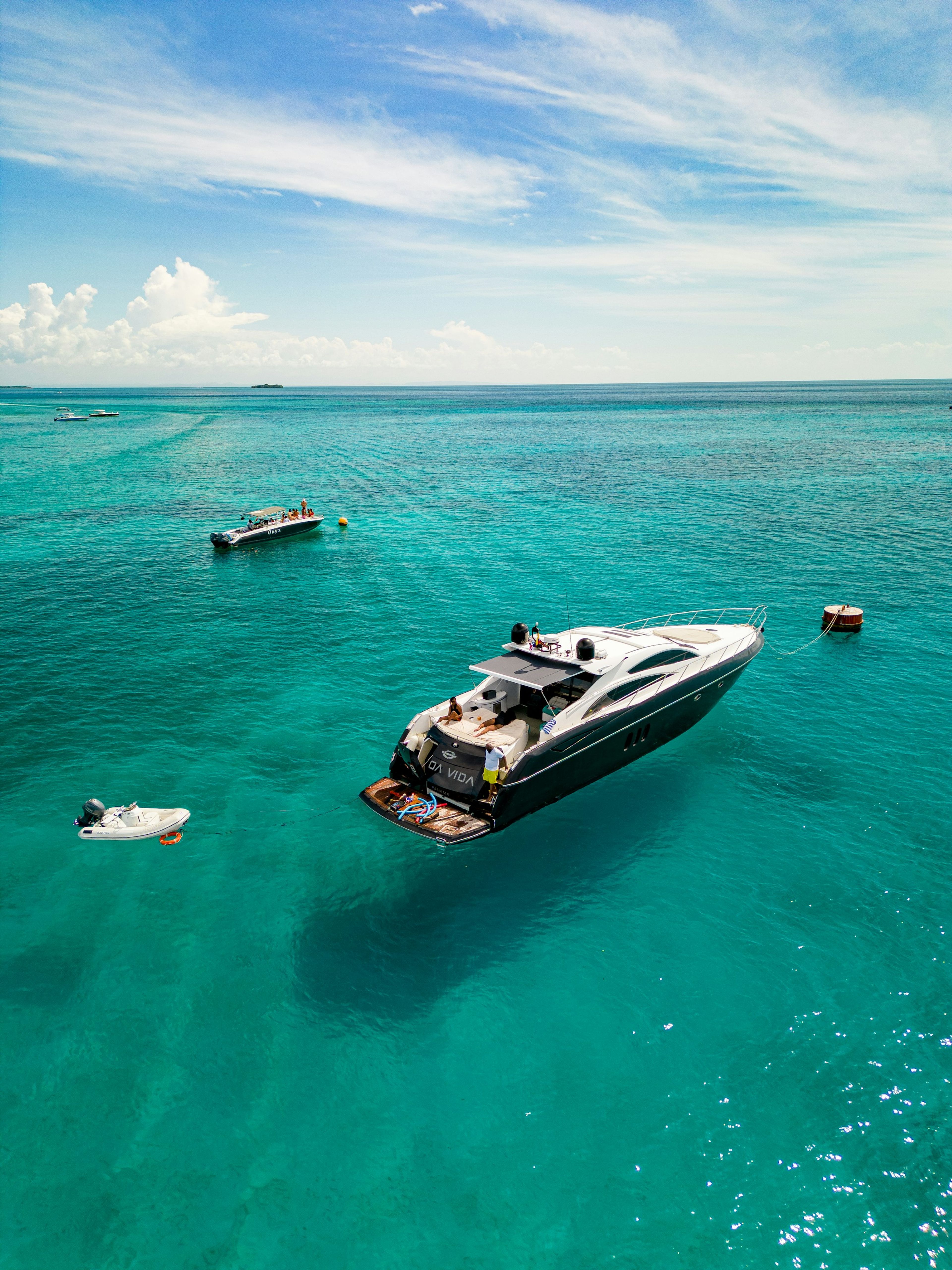 A yacht anchored in clear turquoise water