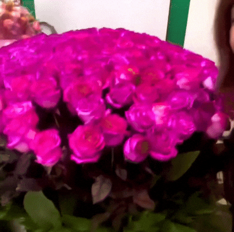 Person at an event looking surprised and delighted when something unexpected happens just for them