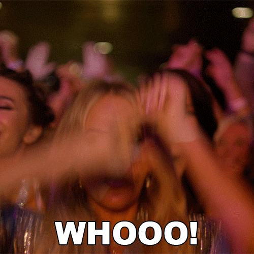 Corporate event audience transitioning from politely seated to standing and dancing with visible energy shift