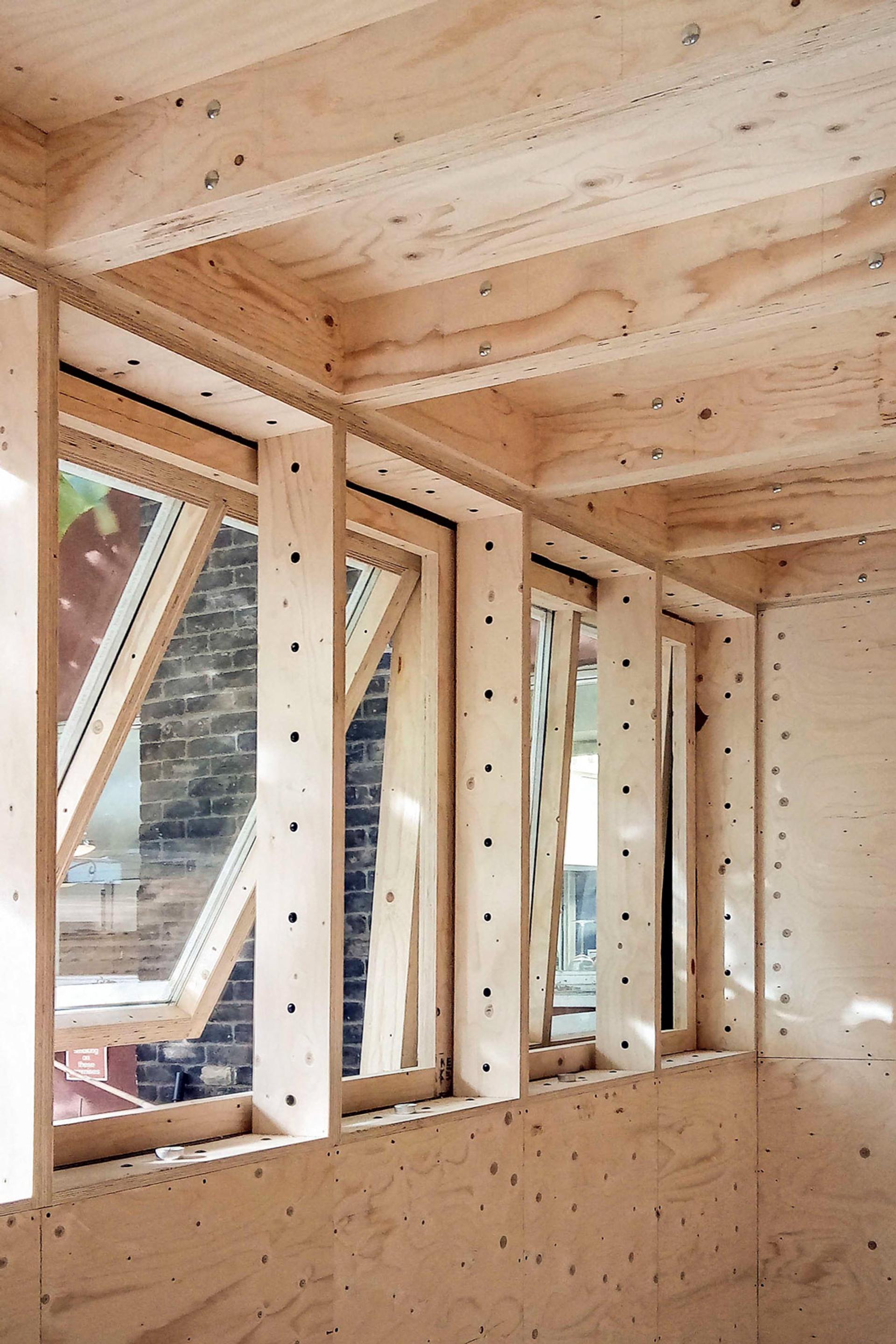 Windows using car pistons as hinges