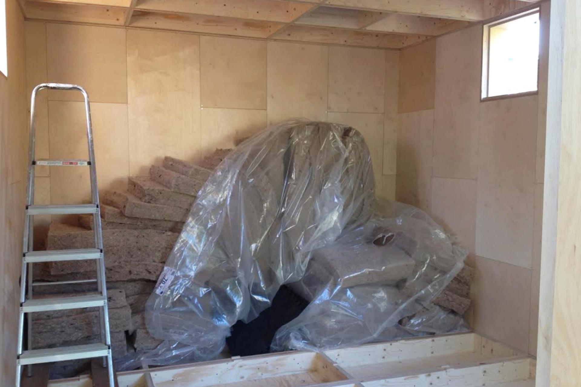Insulation stacked in corner ready to fill the boxes