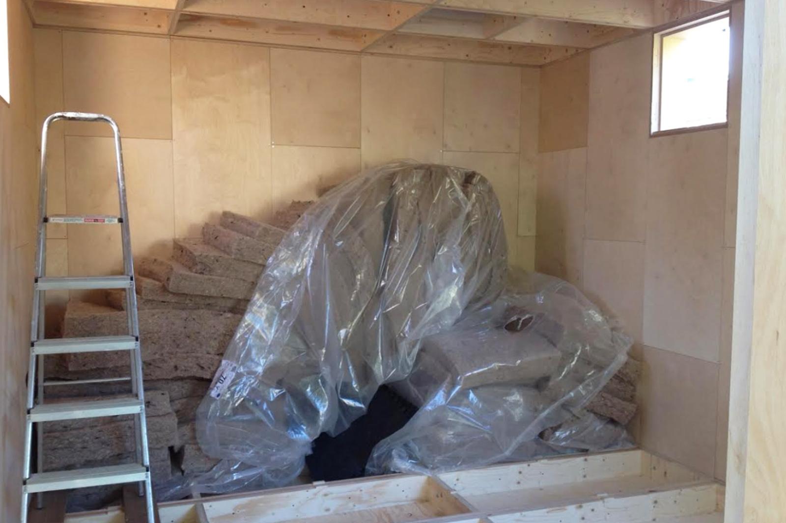 Insulation stacked in corner ready to fill the boxes
