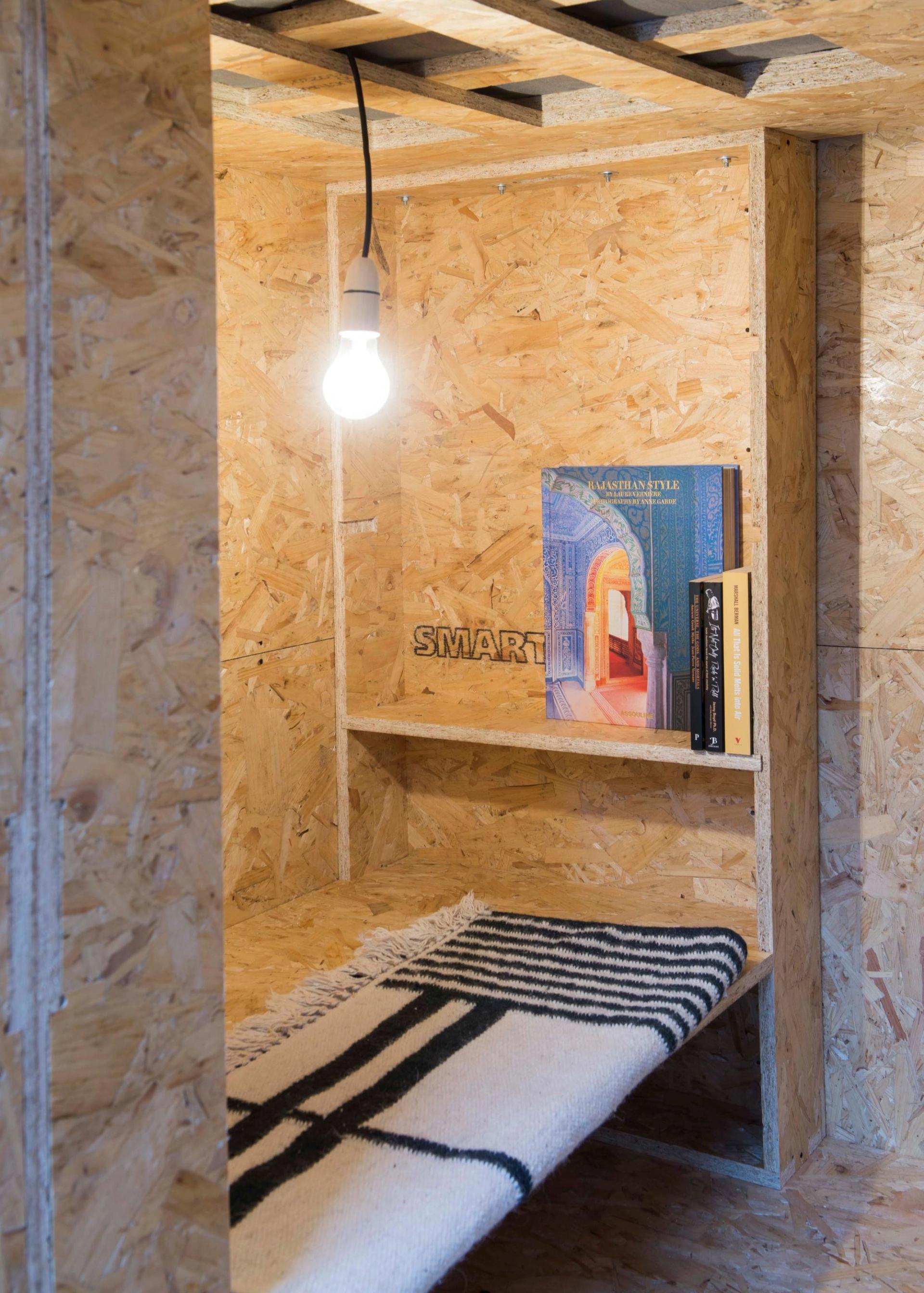 Bed and shelves at the SHED project tiny home