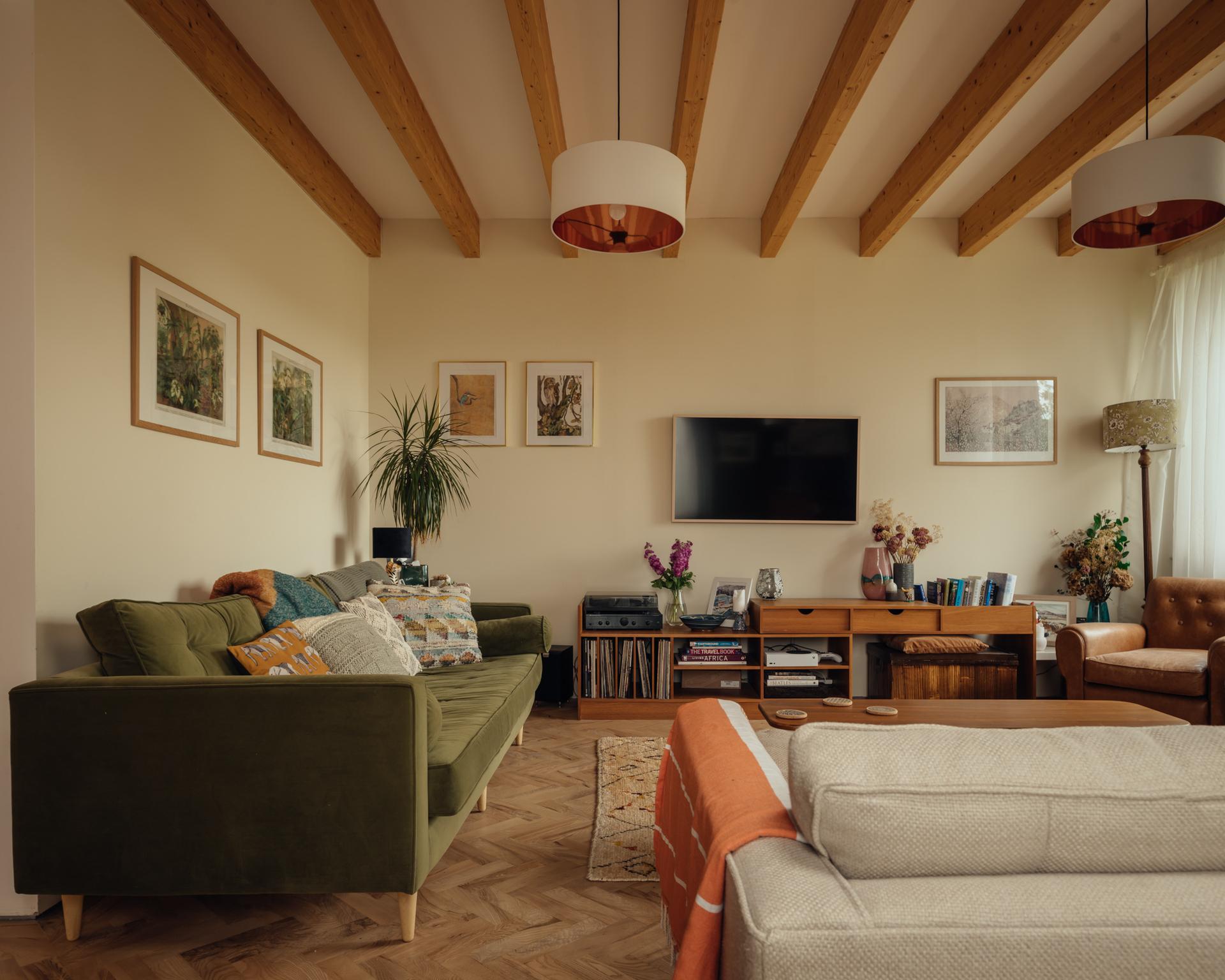 Living room at Orchard House by Studio Bark - a soft mix of oranges and greens