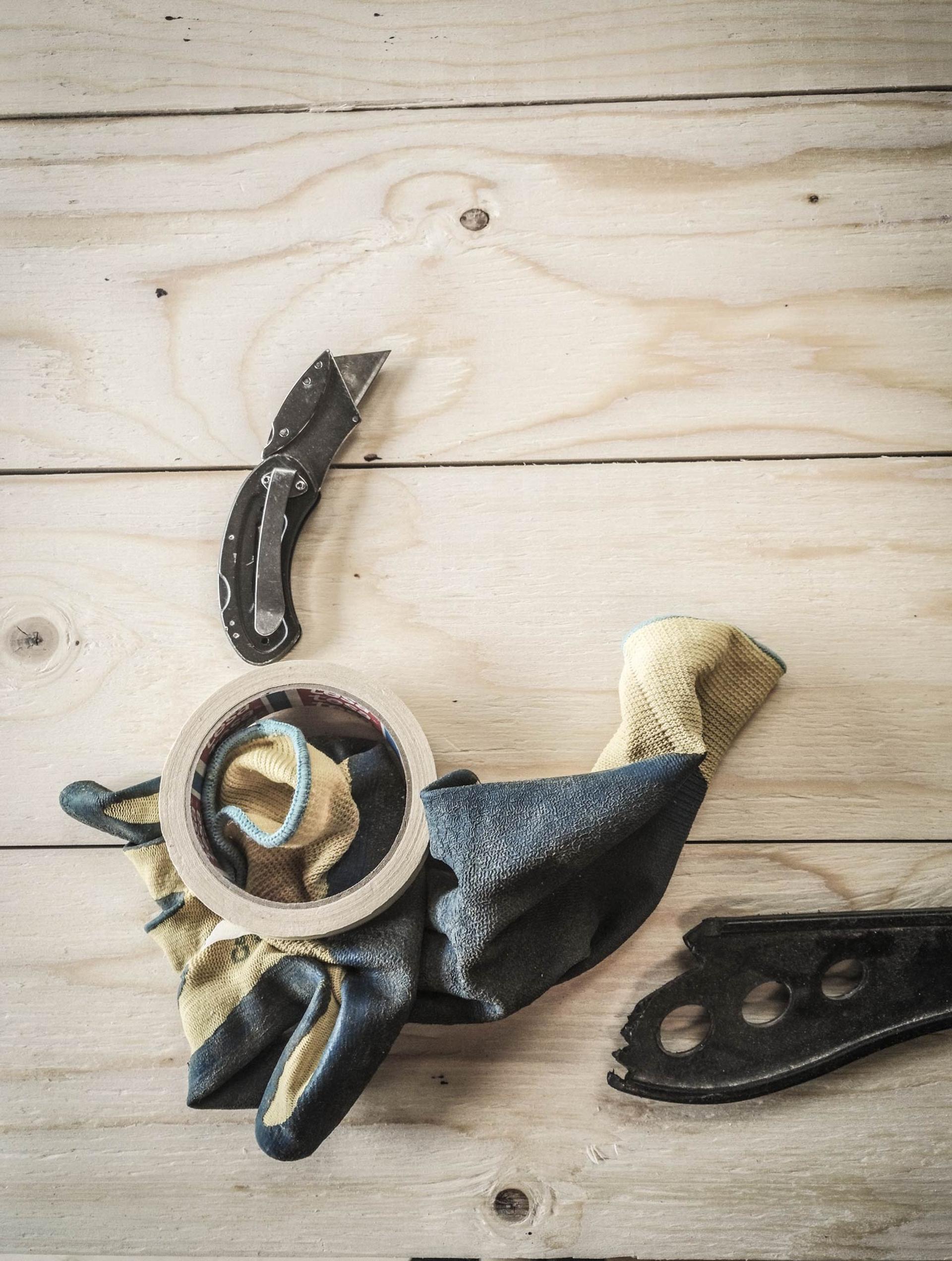 Photo of tools and tape against timber background