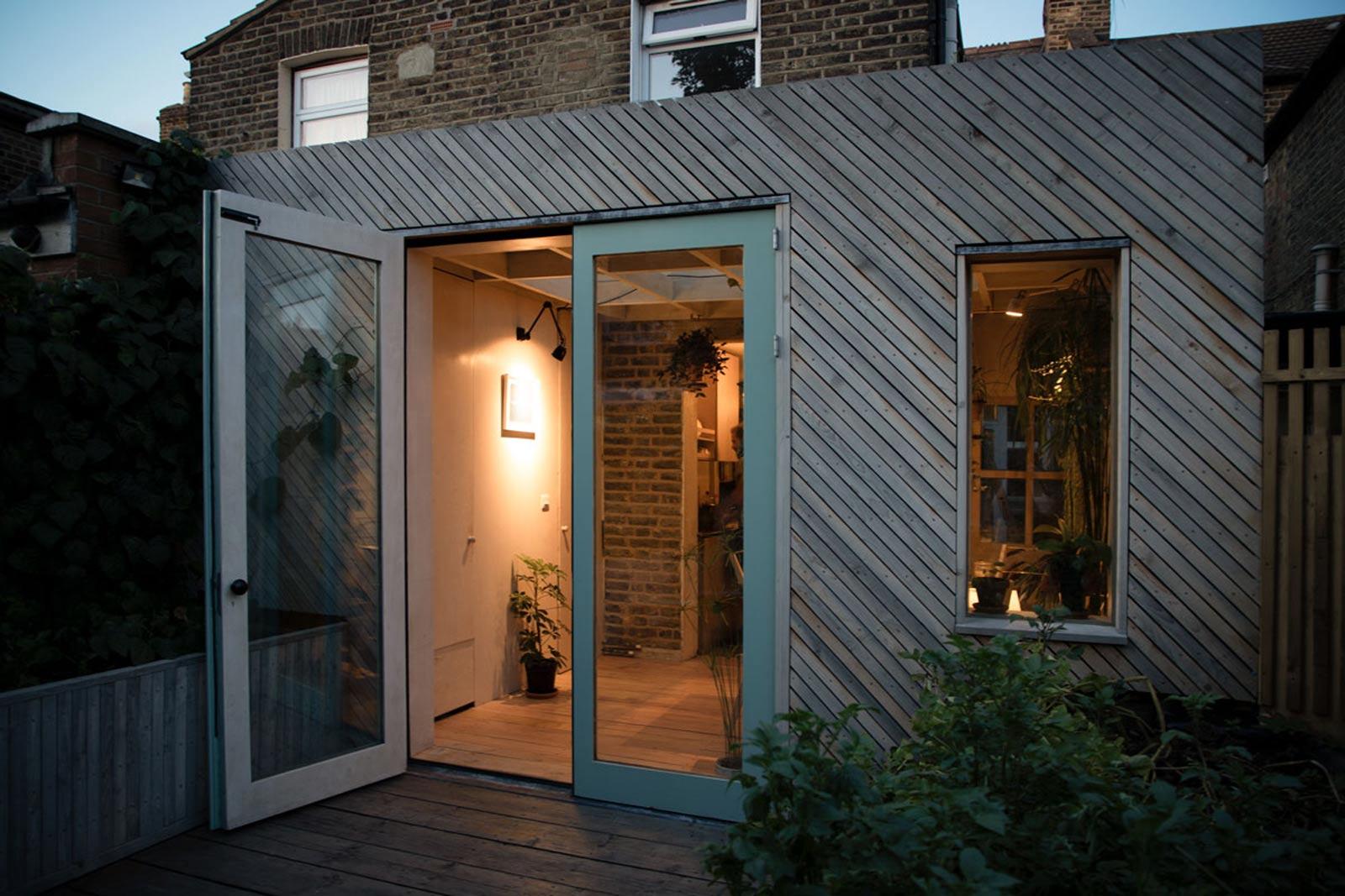 Exterior view of the extension to the Victorian terrace at dusk