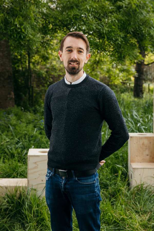 Portrait photograph of Director Tom Bennett