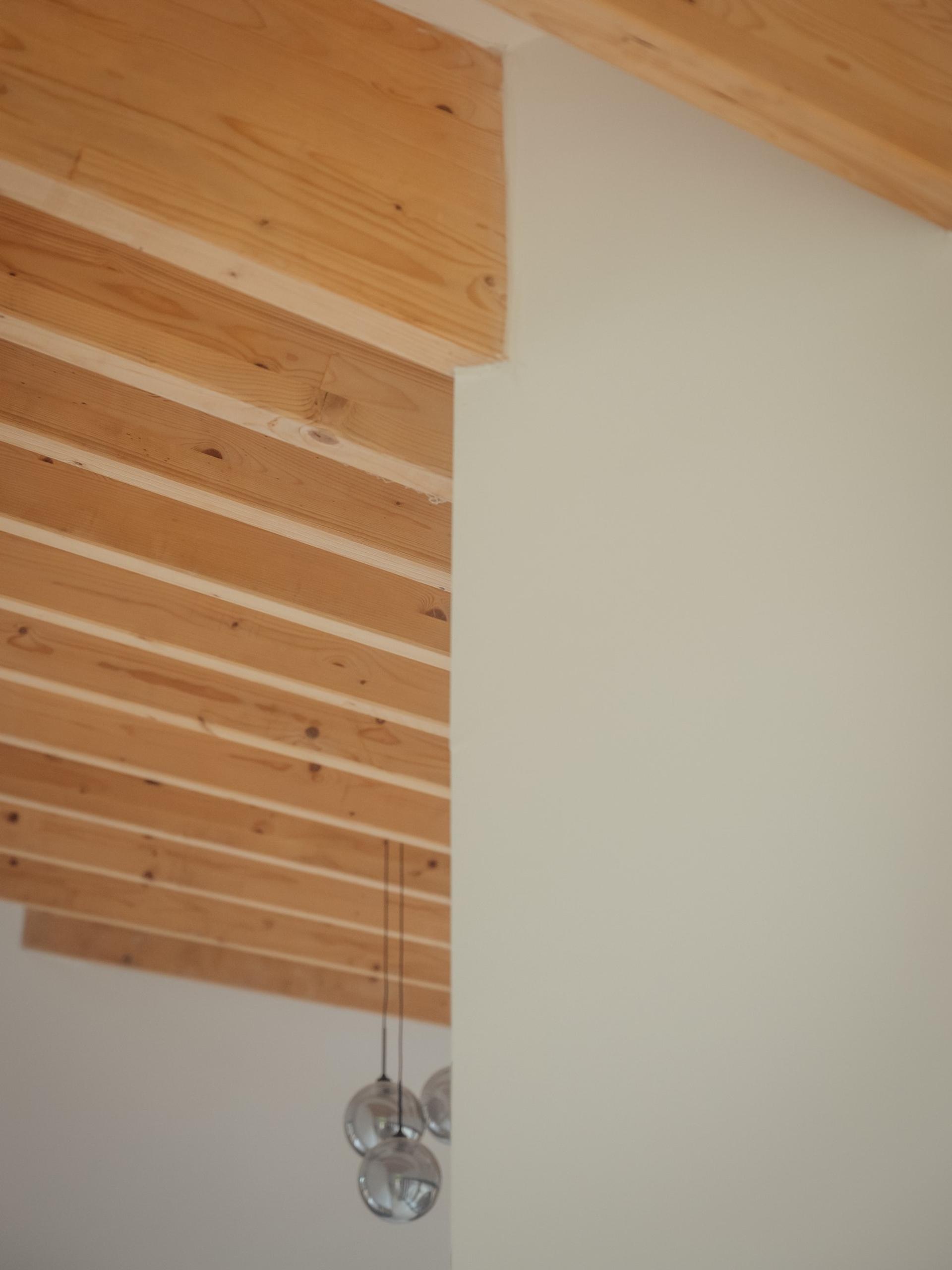 Contemporary exposed timber beams by Studio Bark