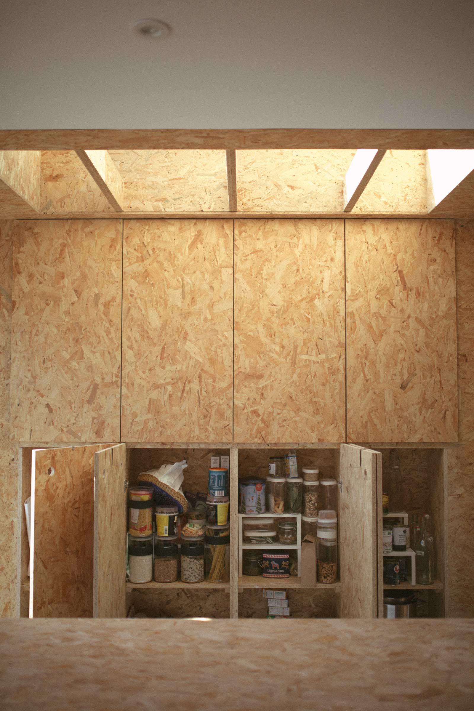 Sun shining through timber cased rooflights inside Grosvenor Road