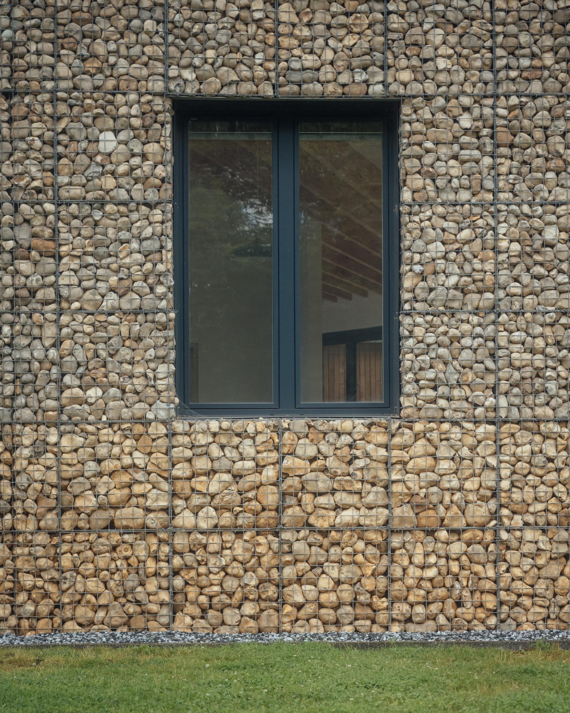 Gabion walls at Pivot House by Studio Bark