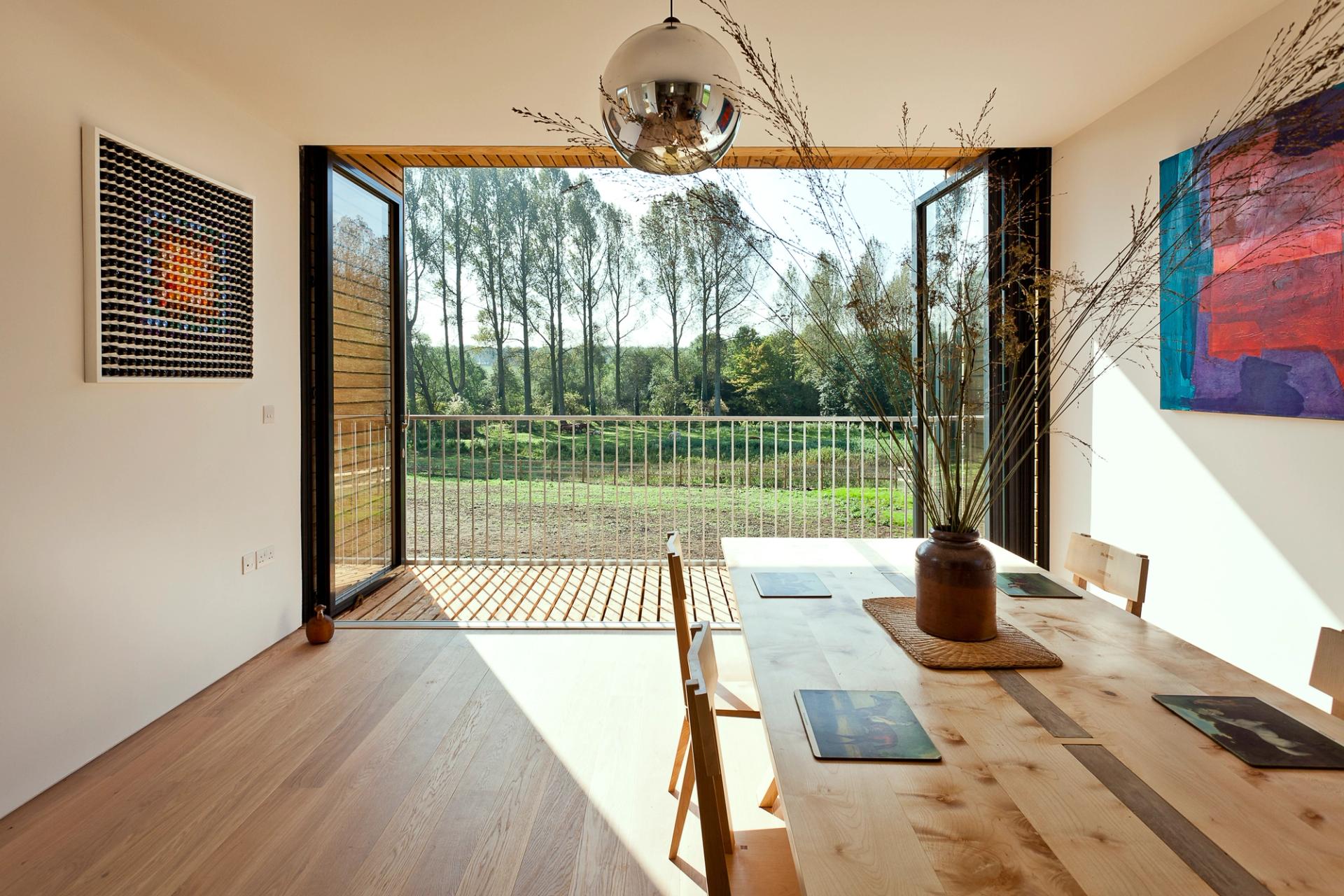 Second floor dining room with full height windows