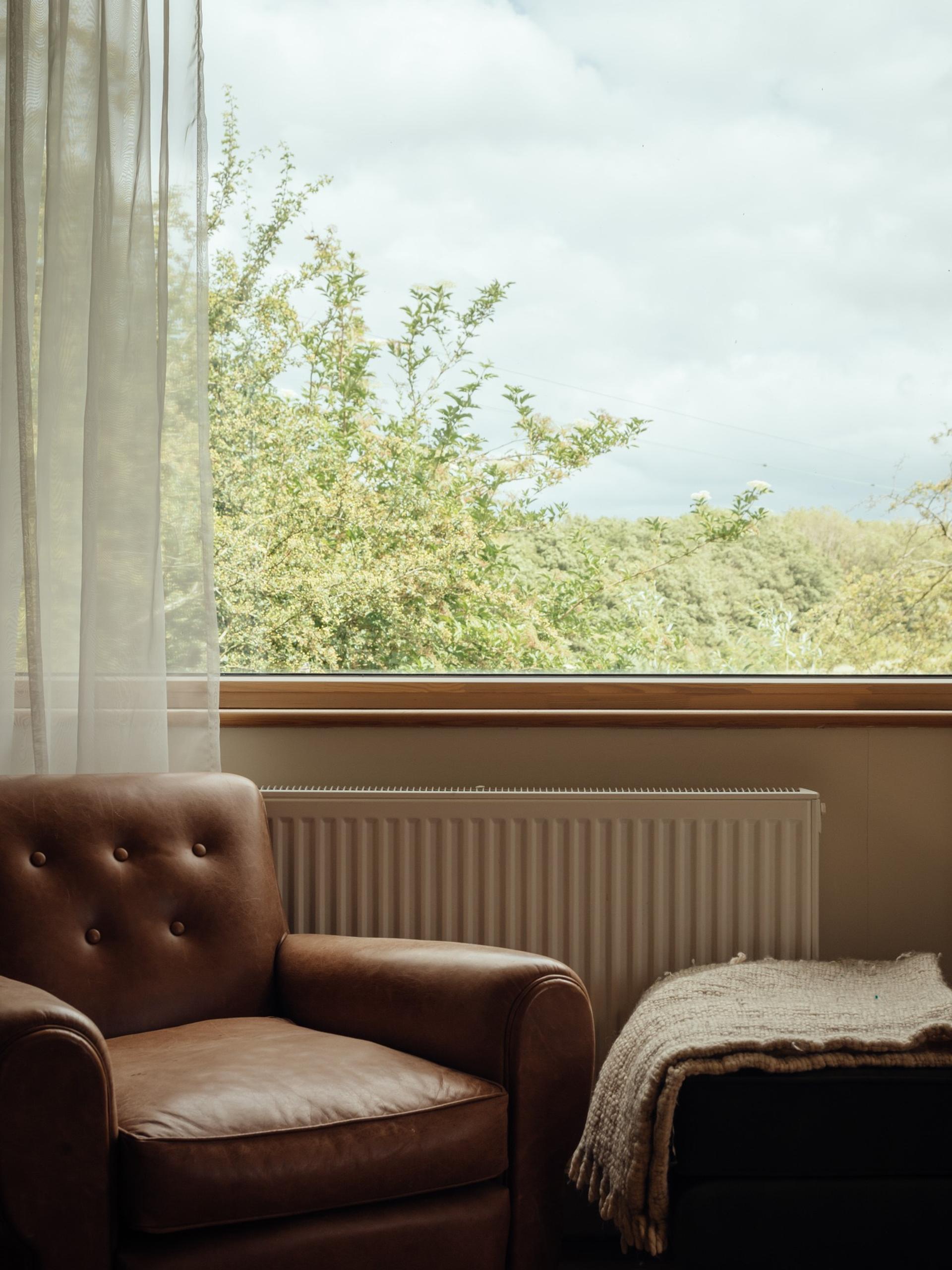 Orchard House by Studio Bark interior view - chair with window