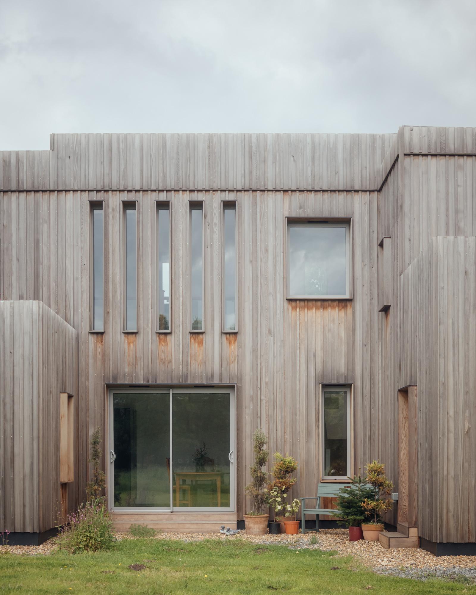 External courtyard view of timber clad Paragraph 80 home