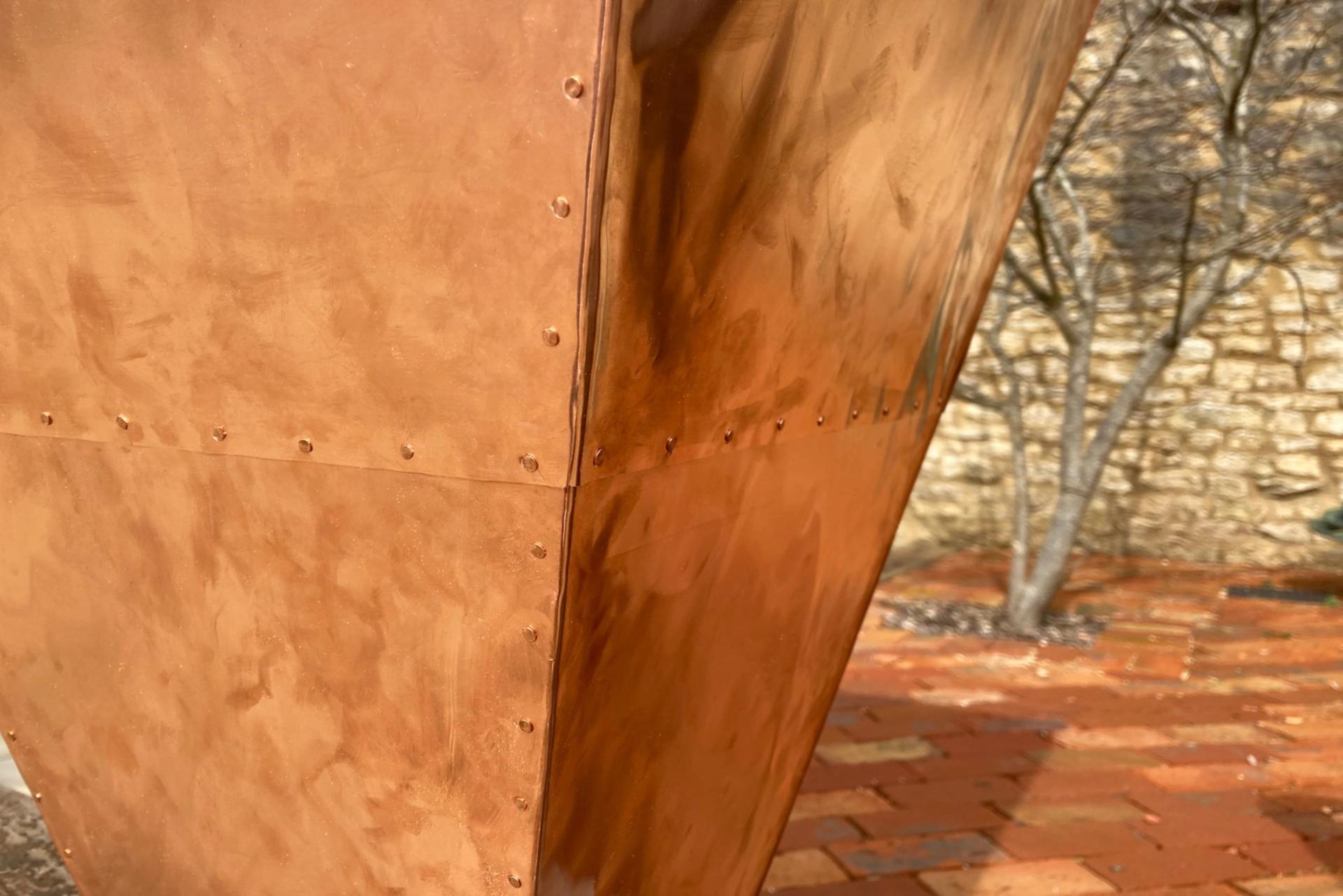 Close up of copper funnel made from thin copper sheets