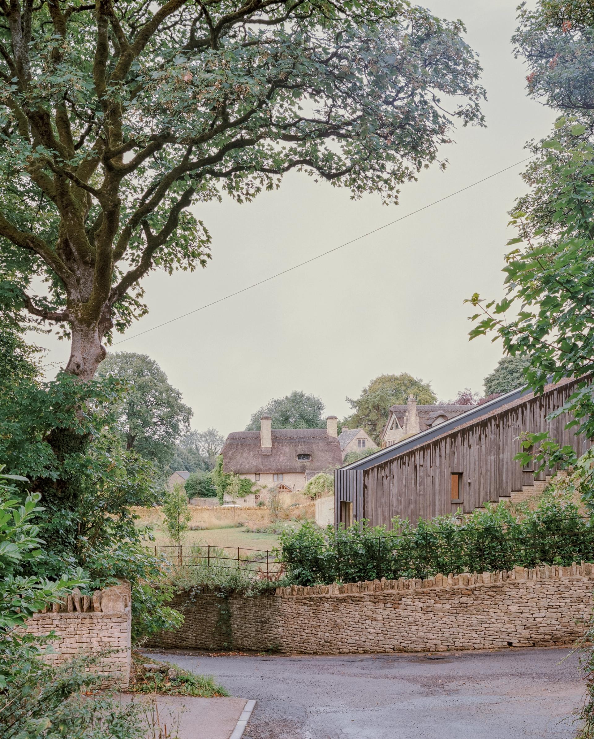 Sloping form of Oolite House in the Cotswolds by Studio Bark