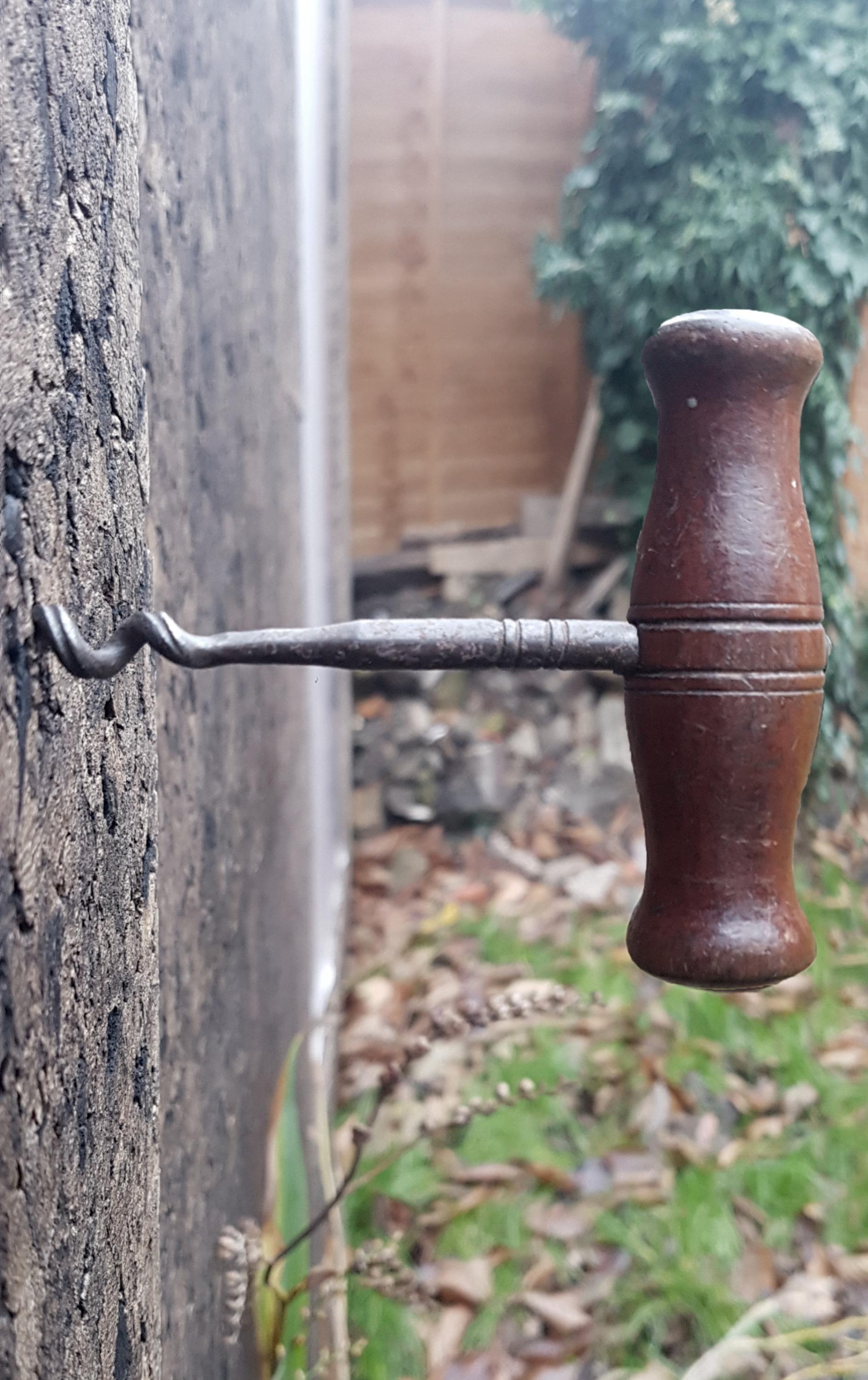 Corkscrew handle screwed into wall of Cork Studio