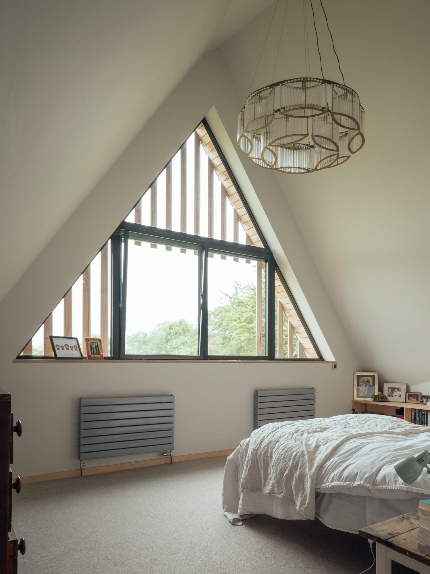 Bedroom with pitched window by Studio Bark