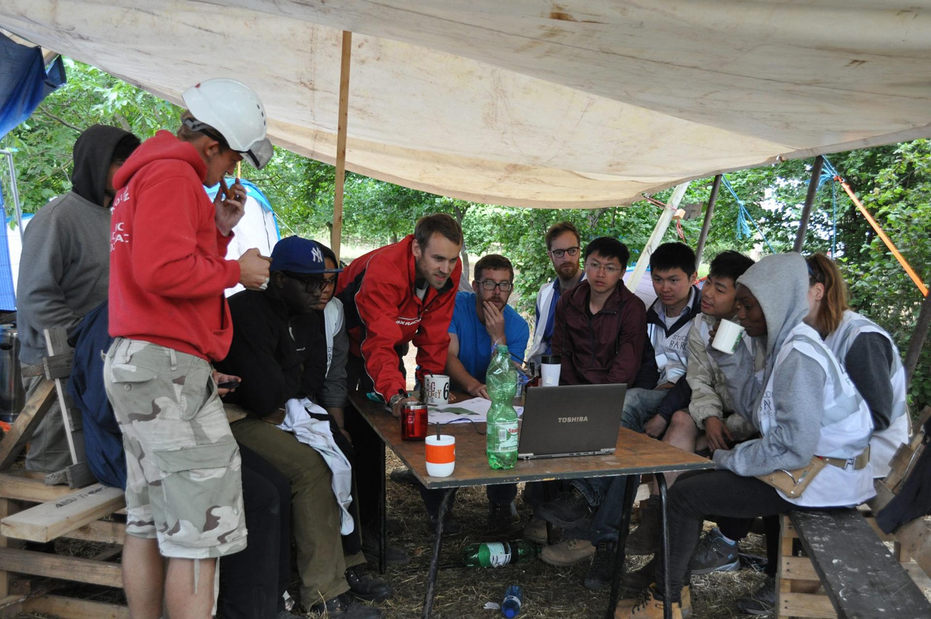 Students on-site learning, mentored by professionals in the construction industry