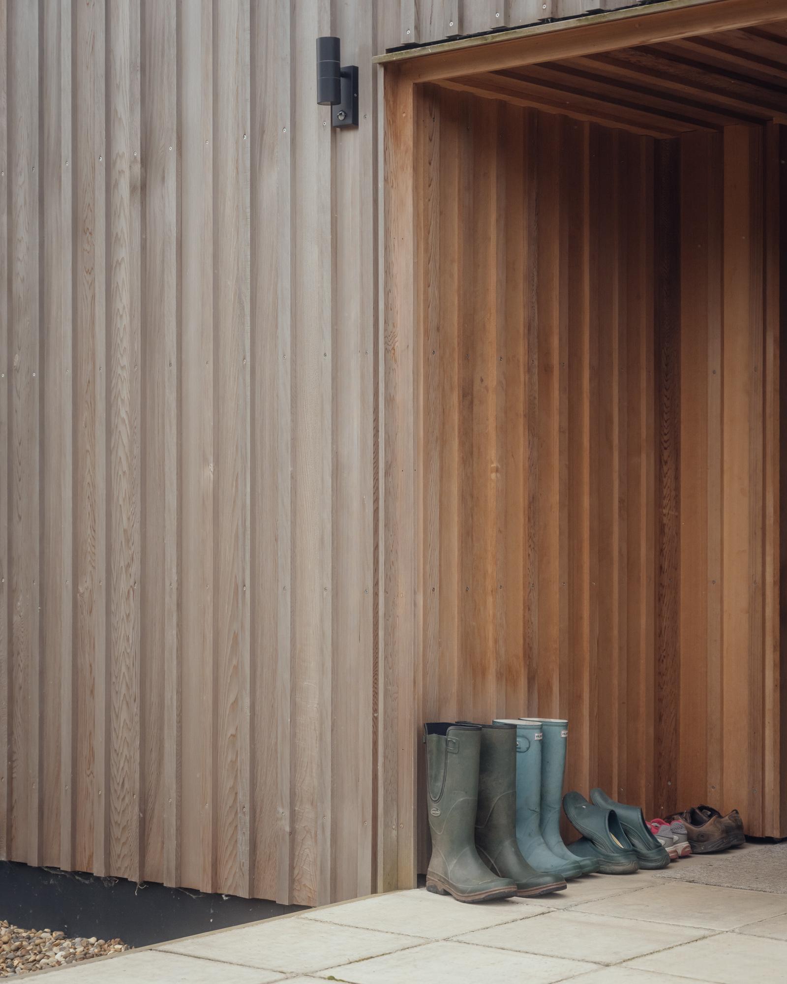 Porch entrance to contemporary timber clad home by Studio Bark