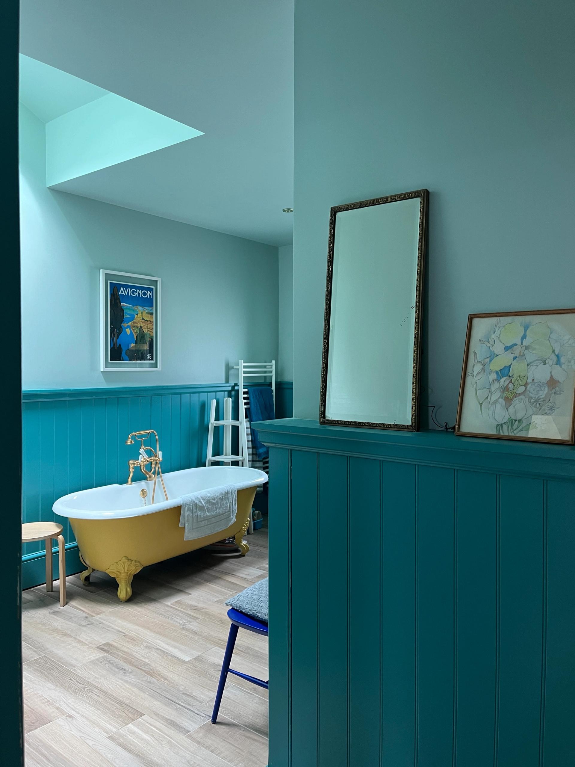 Renovated bathroom with Victorian features and tonal blue walls
