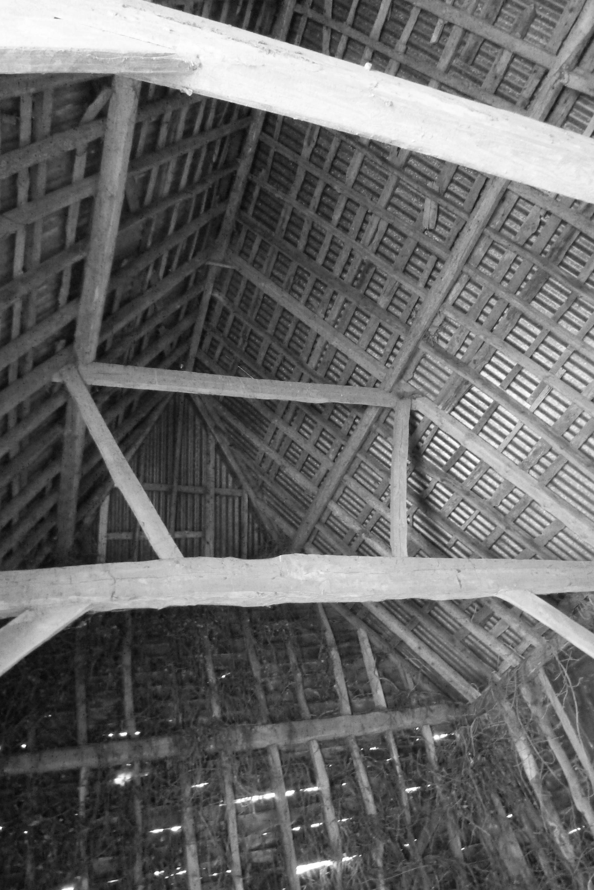 Black and white photograph of historic barn building