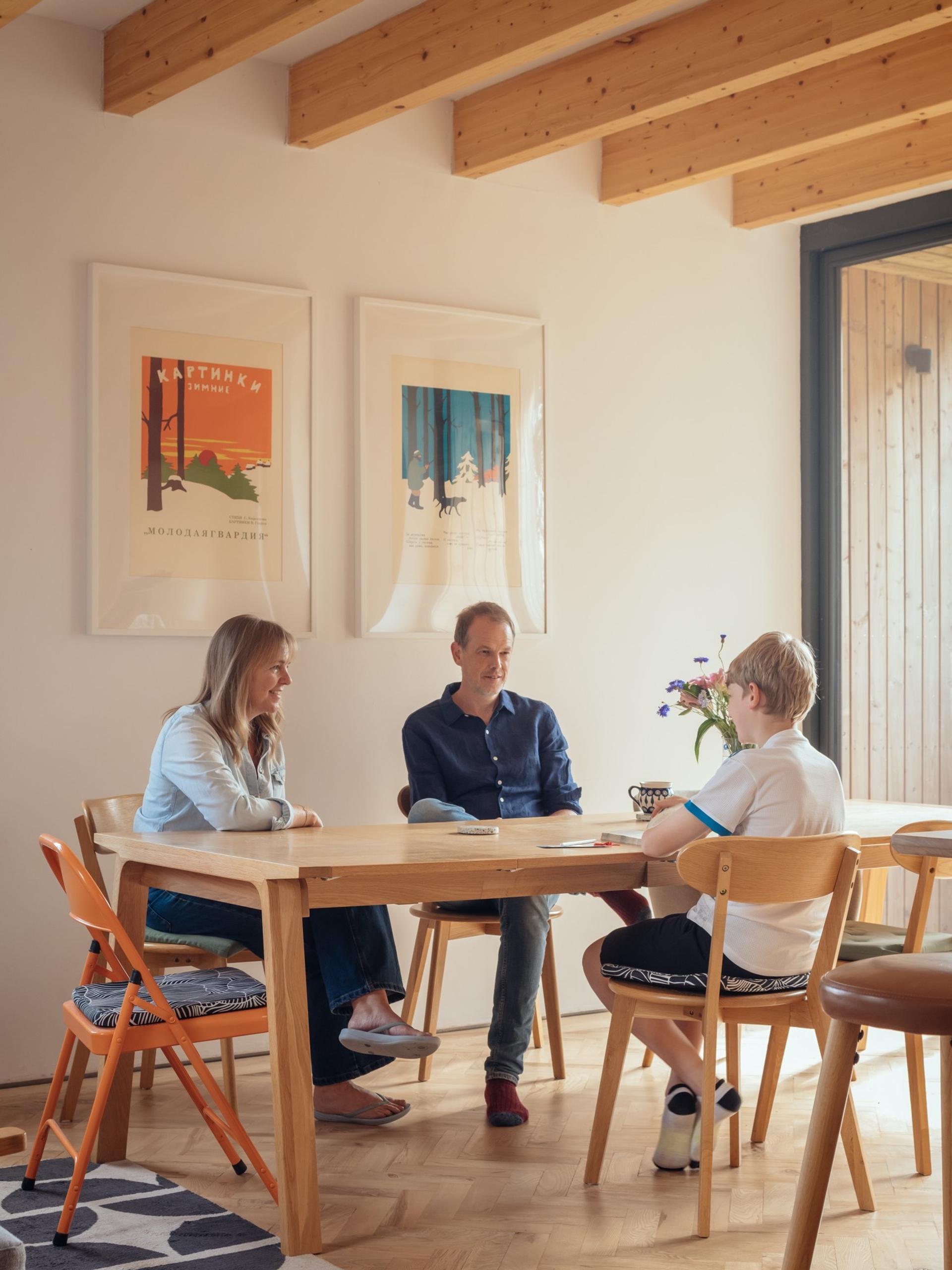Orchard House by Studio Bark interior view - dining table with people