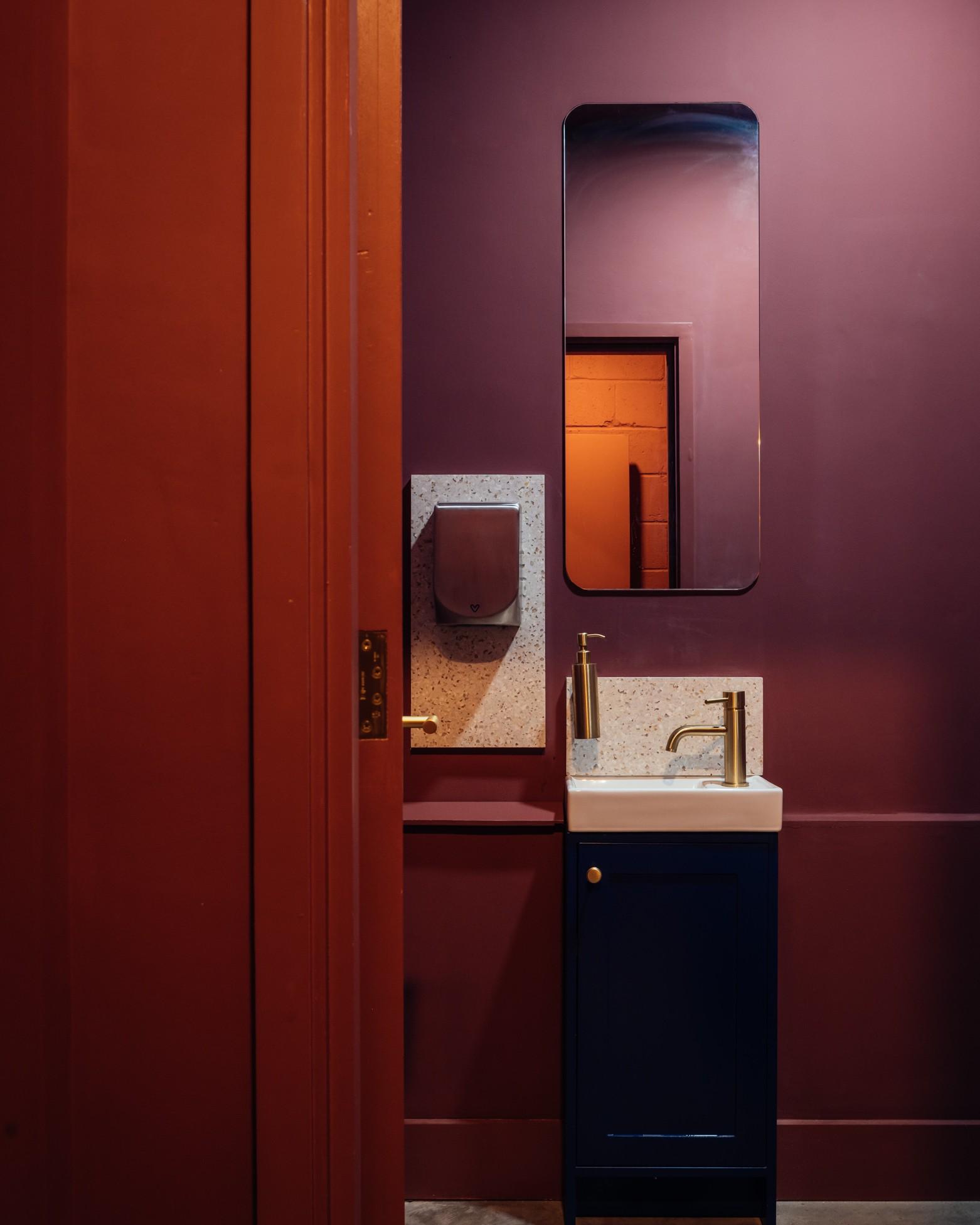'ladybug' colour drenched bathrooms