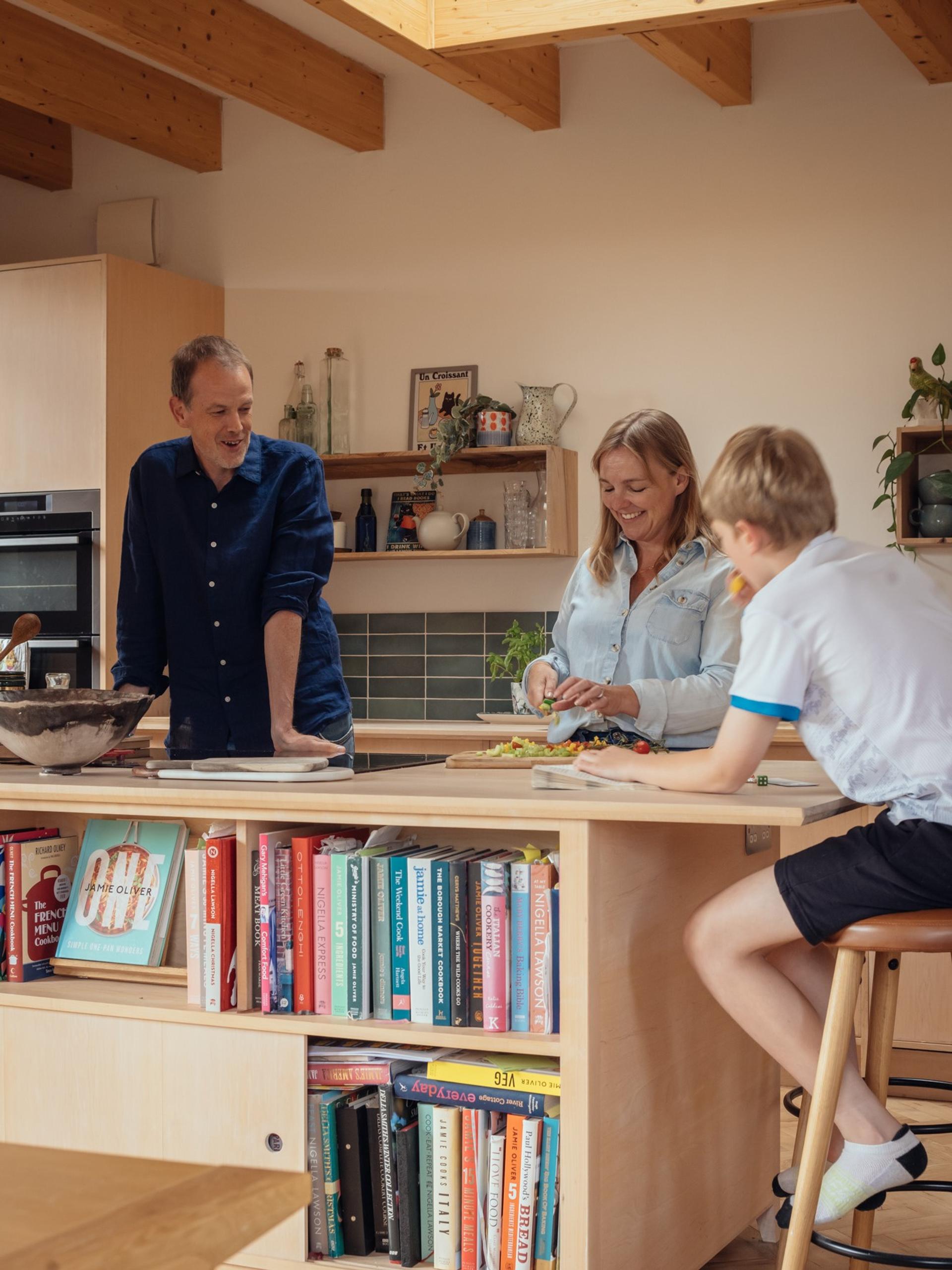 Orchard House by Studio Bark interior view - kitchen with island and people