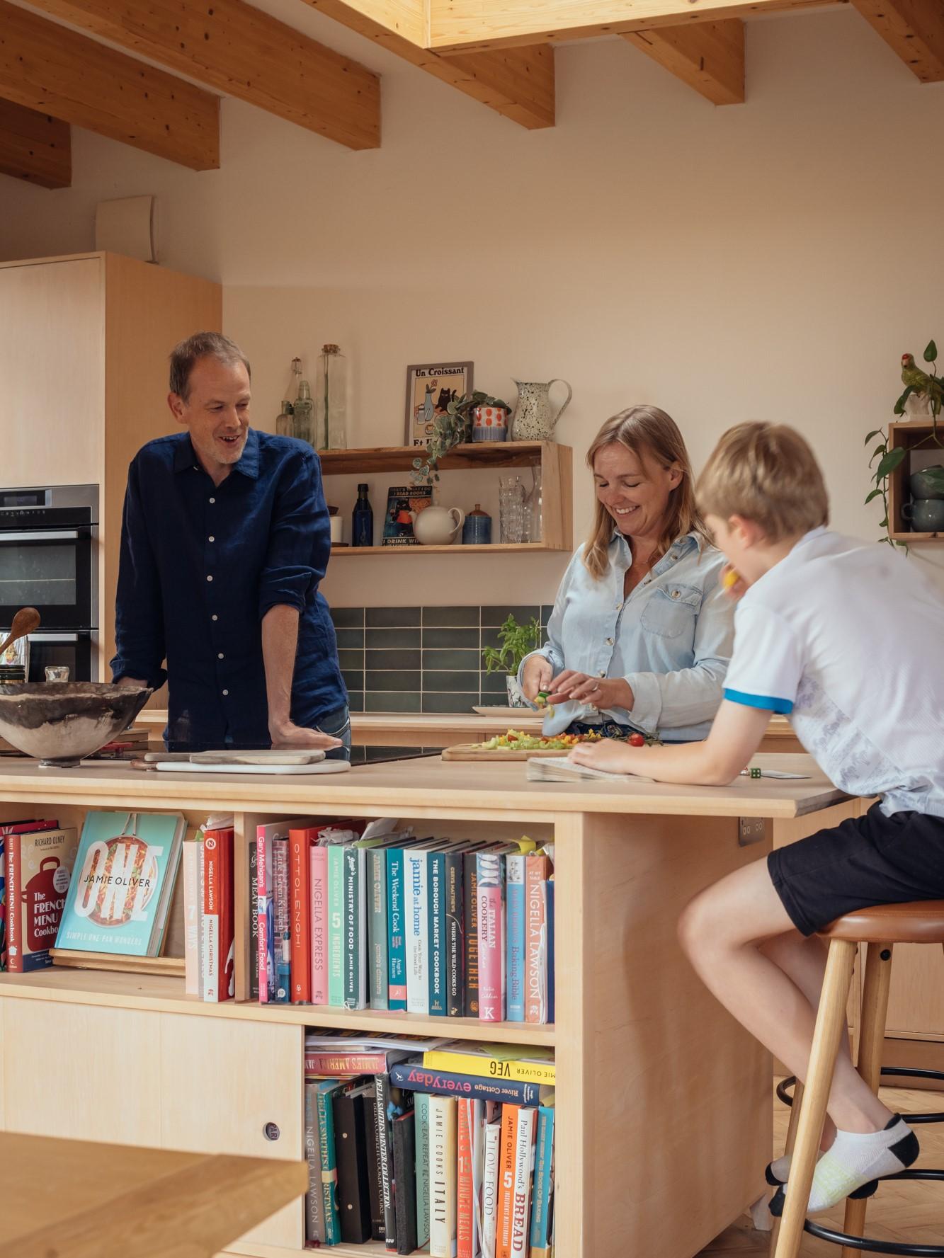 Orchard House by Studio Bark interior view - kitchen with island and people