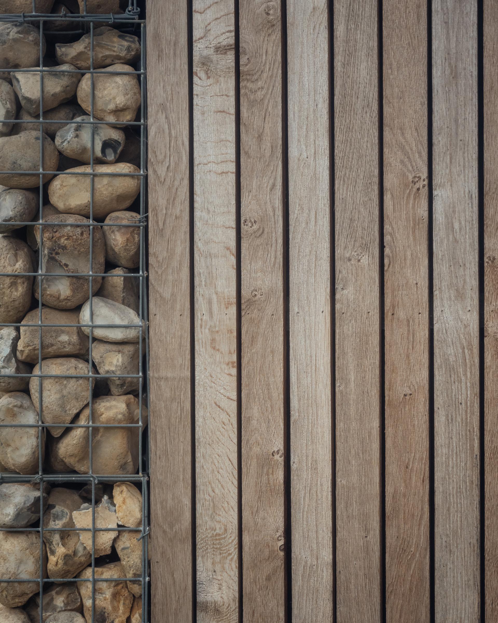 Gabion walls at Pivot House by Studio Bark