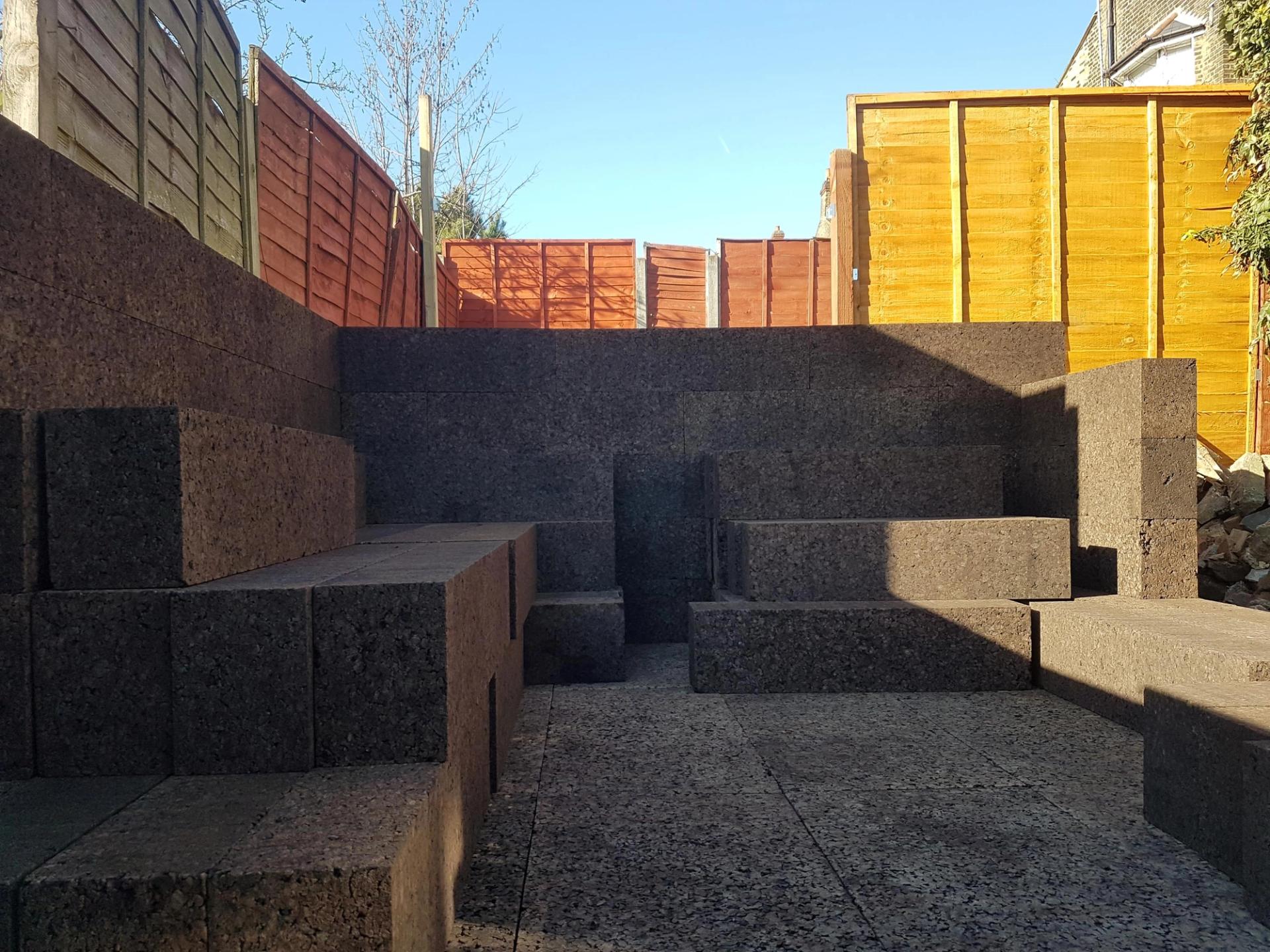Cork blocks stacked, ready to make the external walls of the Cork Studio